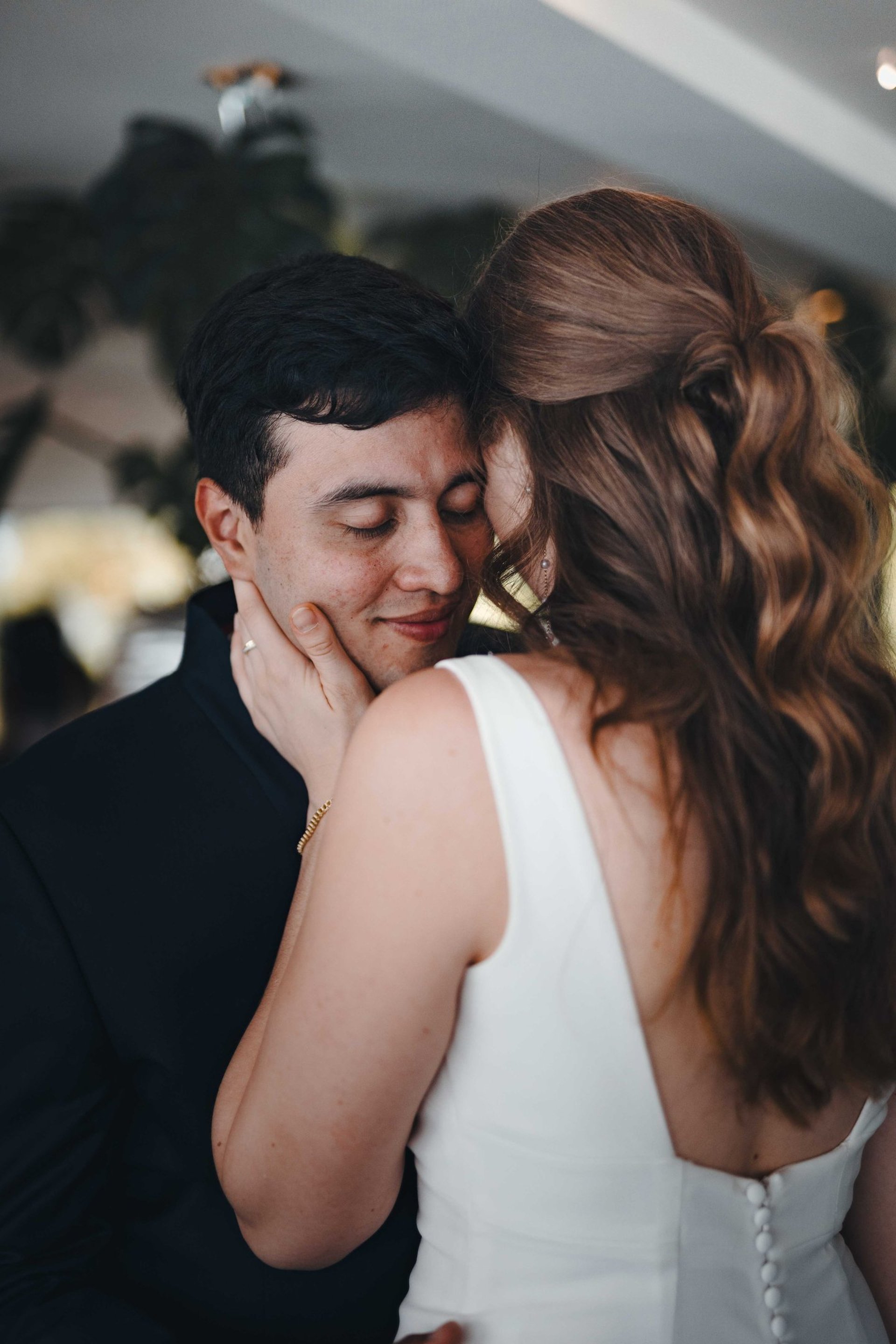 an abstract photo of a curved building with a blue sky in the background
