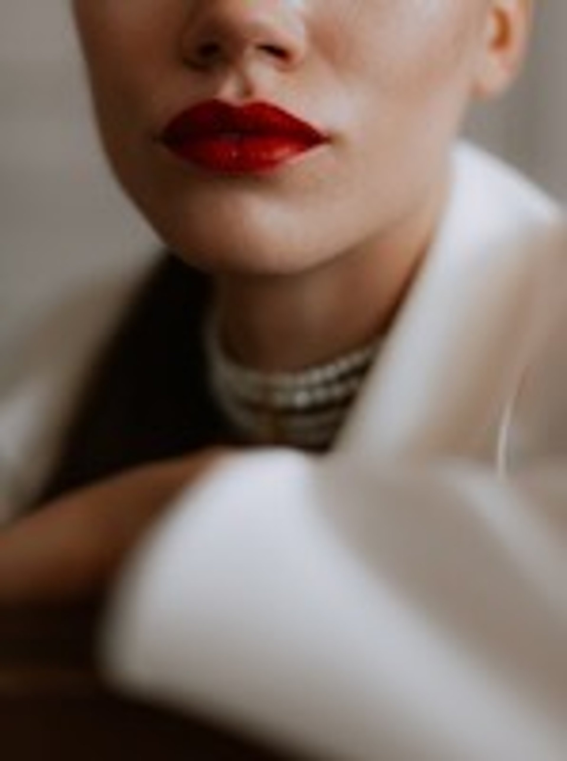 a close up of a woman with red lipstick