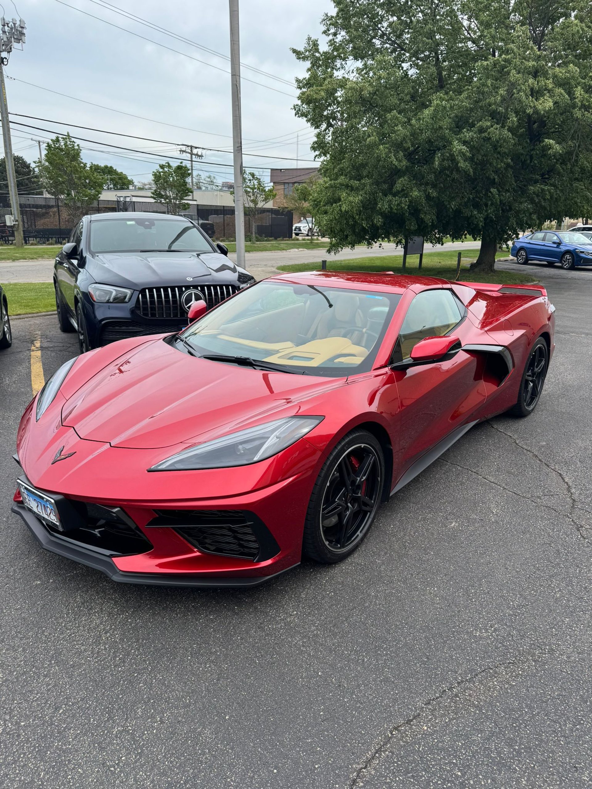 A yellow corvette with its logo.