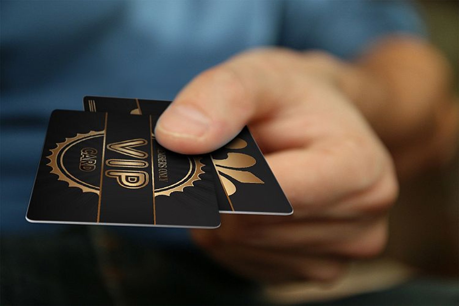 person holding black rectangular paper