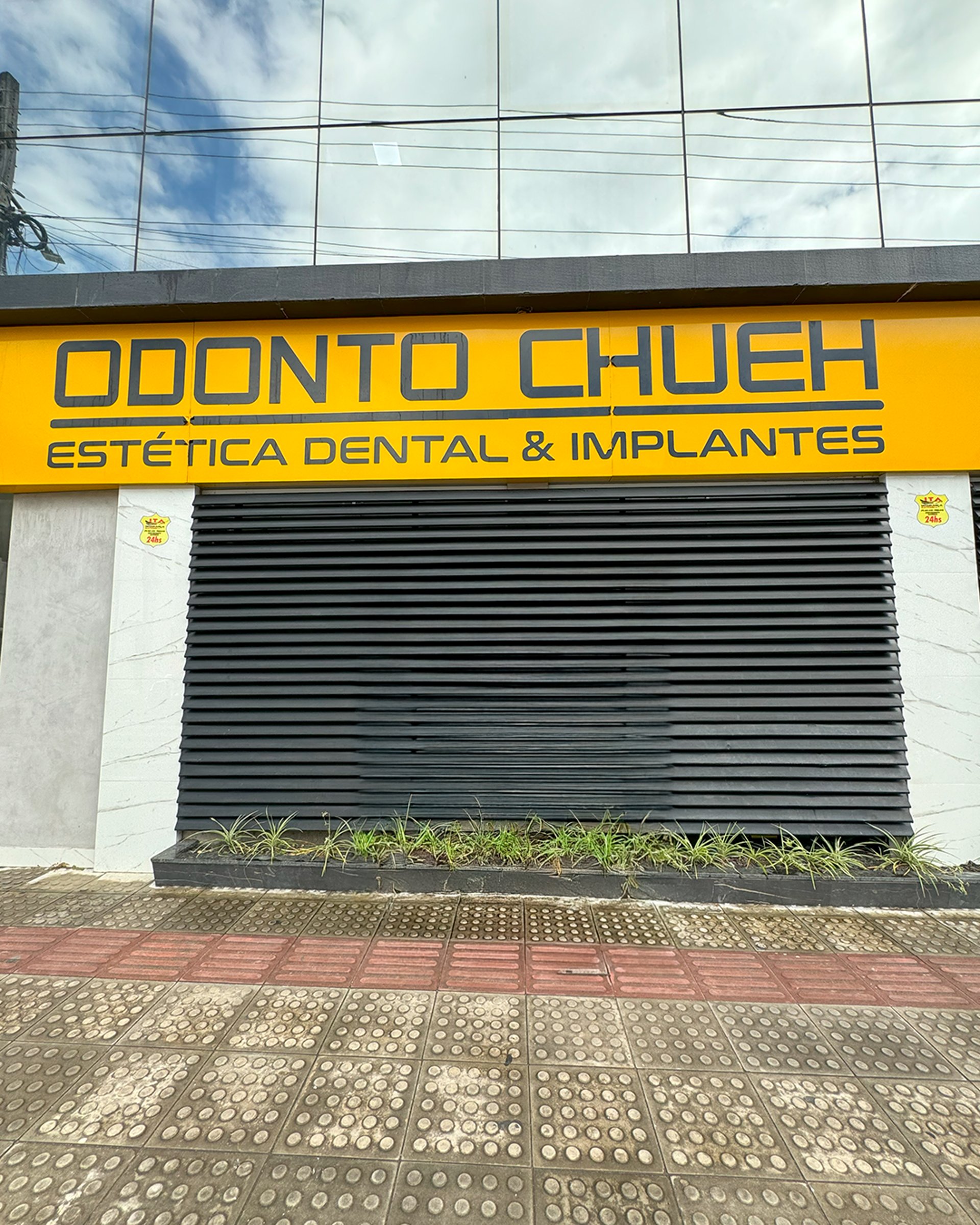an abstract photo of a curved building with a blue sky in the background