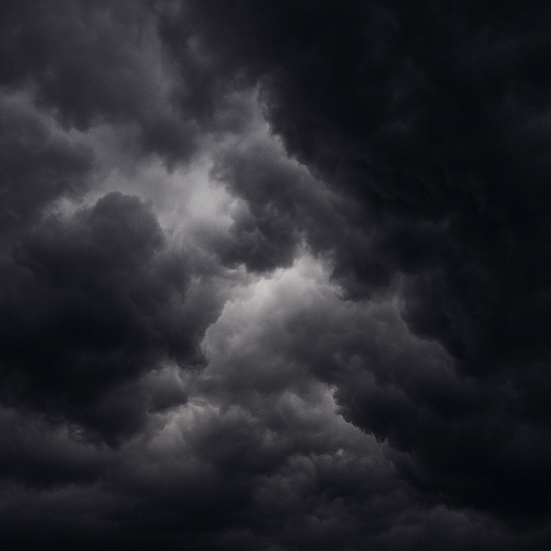 a black background with a blue wave of light