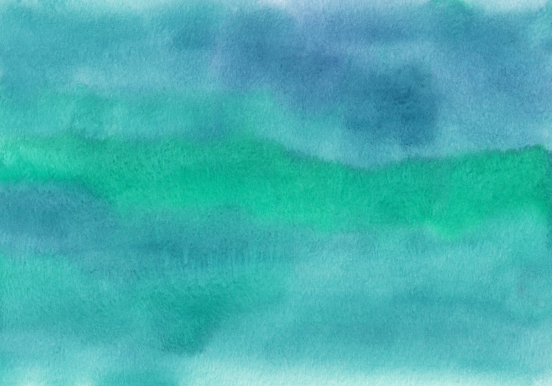 a large body of water under a cloudy sky
