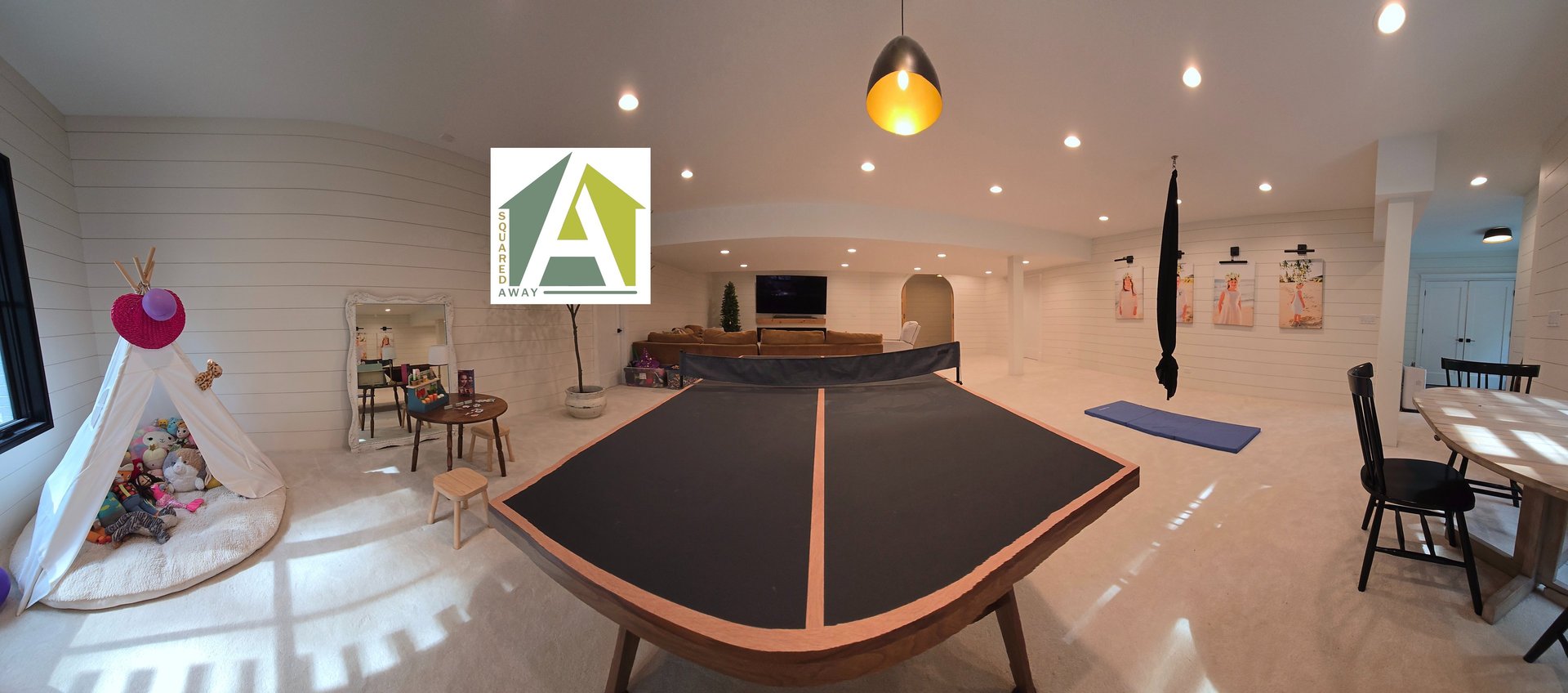 a large kitchen with a center island in the middle of the room