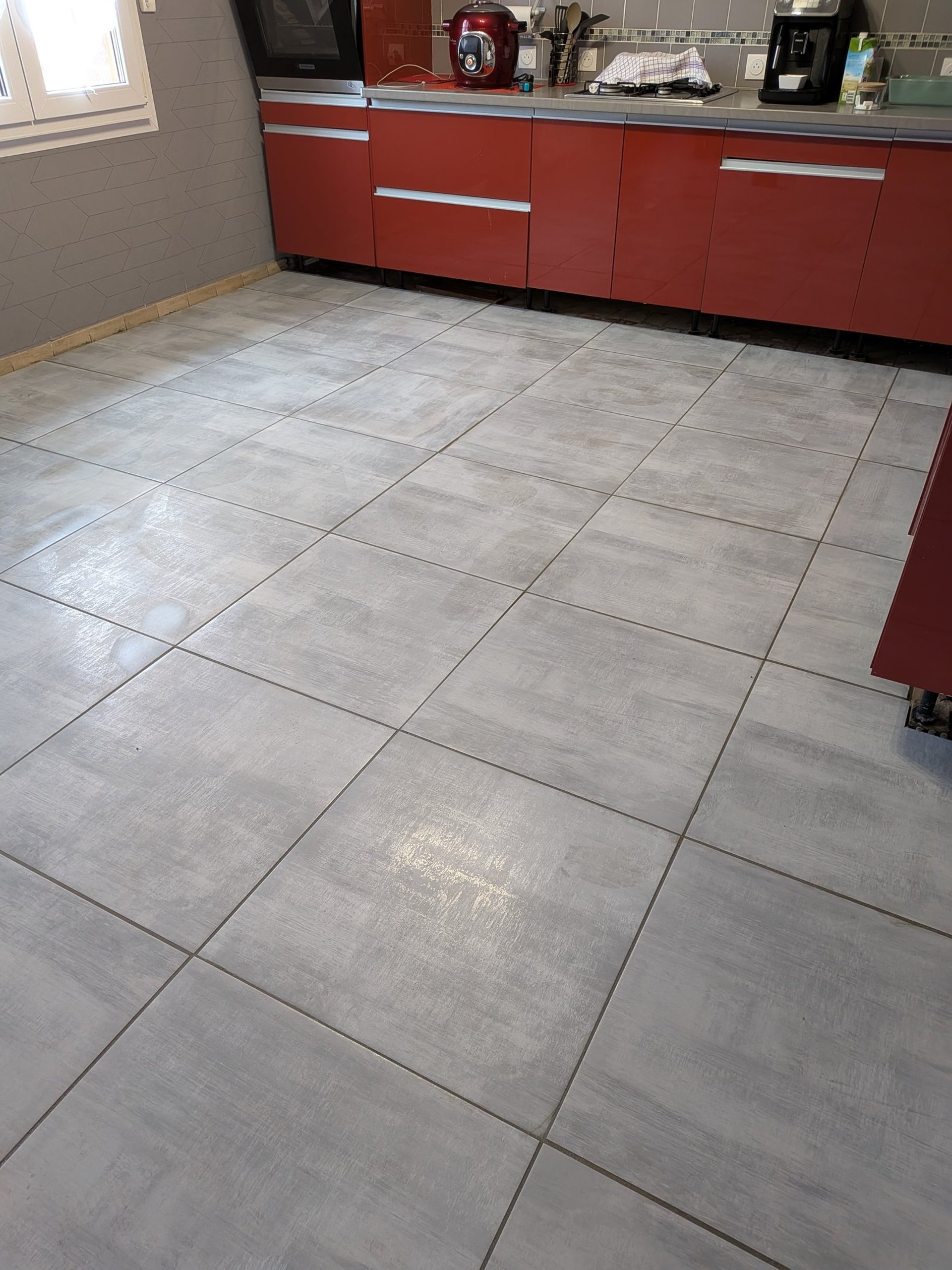 a bathroom with a marble wall and floor
