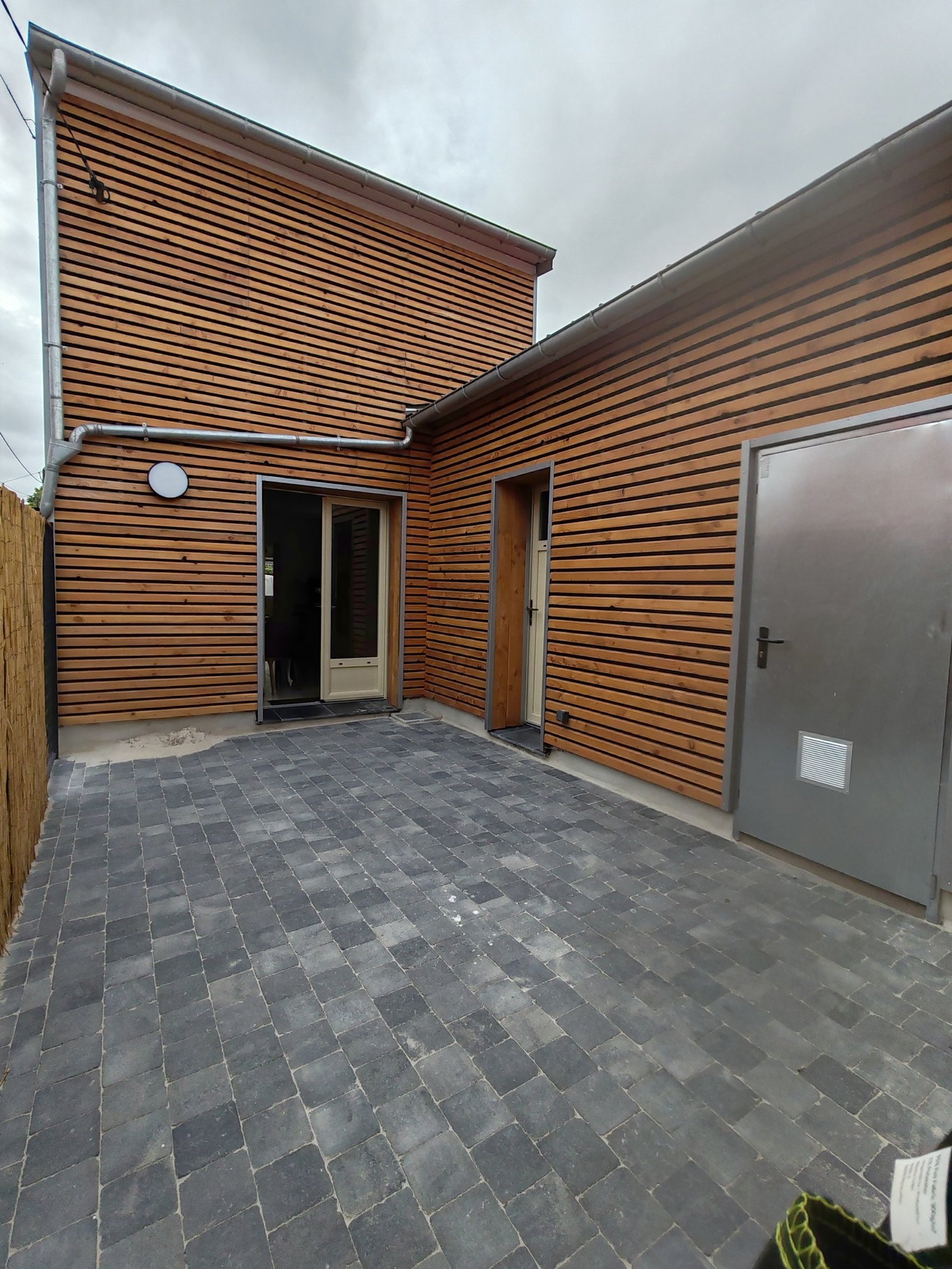 an abstract photo of a curved building with a blue sky in the background