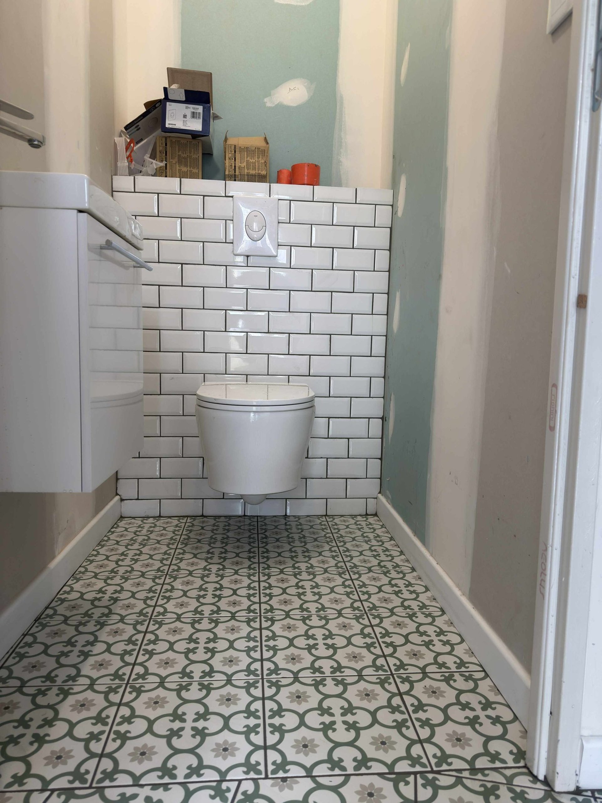 person holding white tile