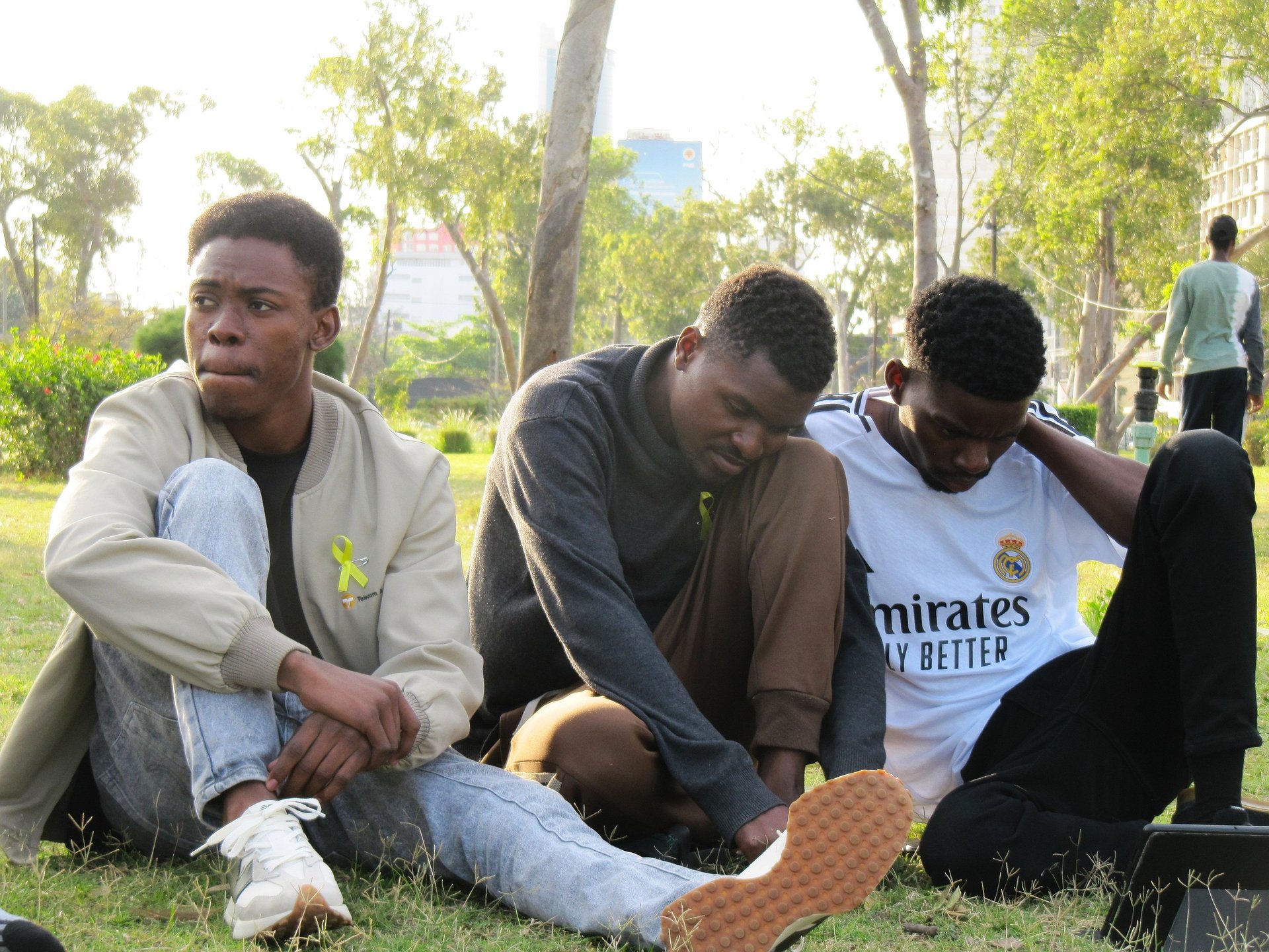 an abstract photo of a curved building with a blue sky in the background