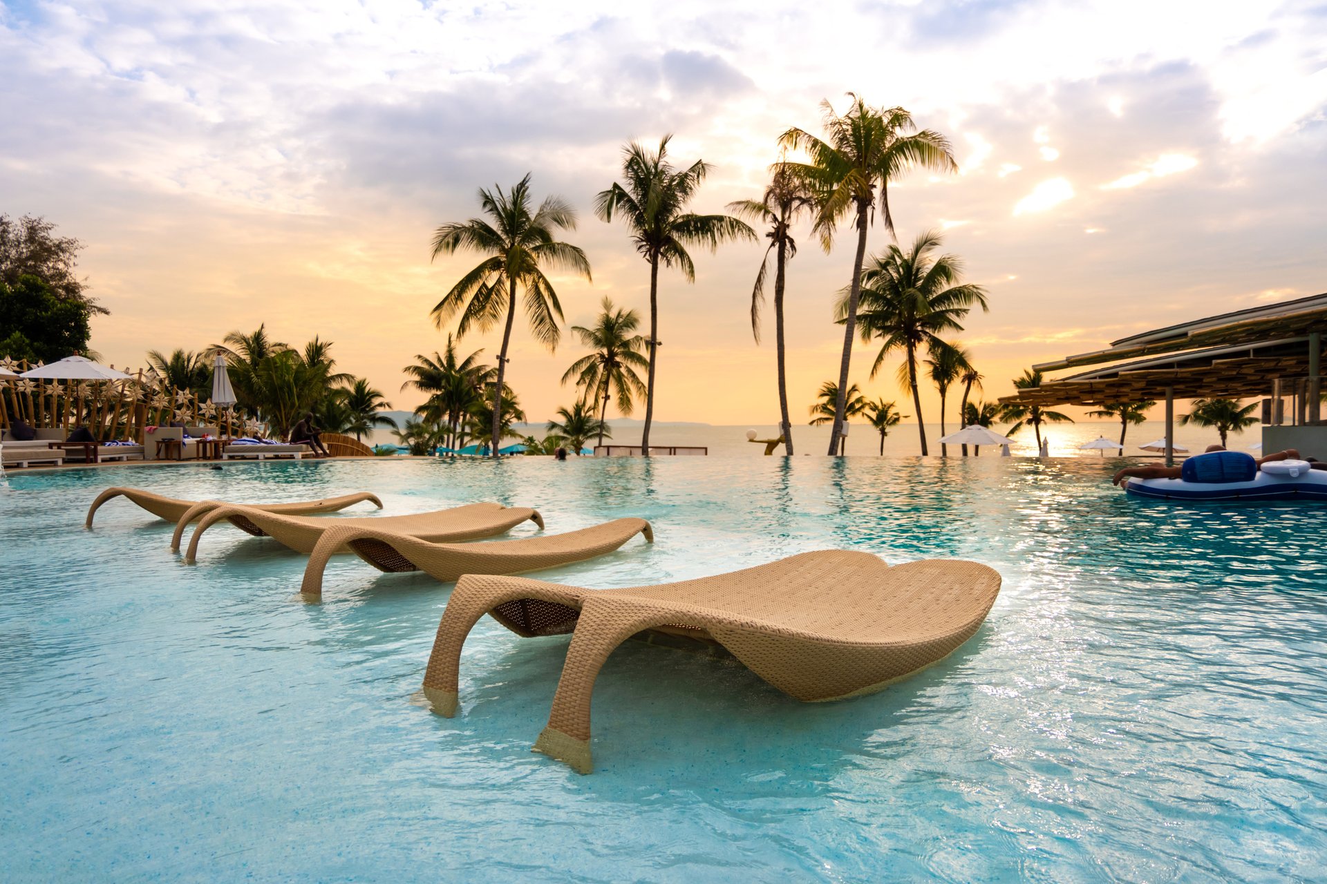 coconut trees under cloudy sky during daytime