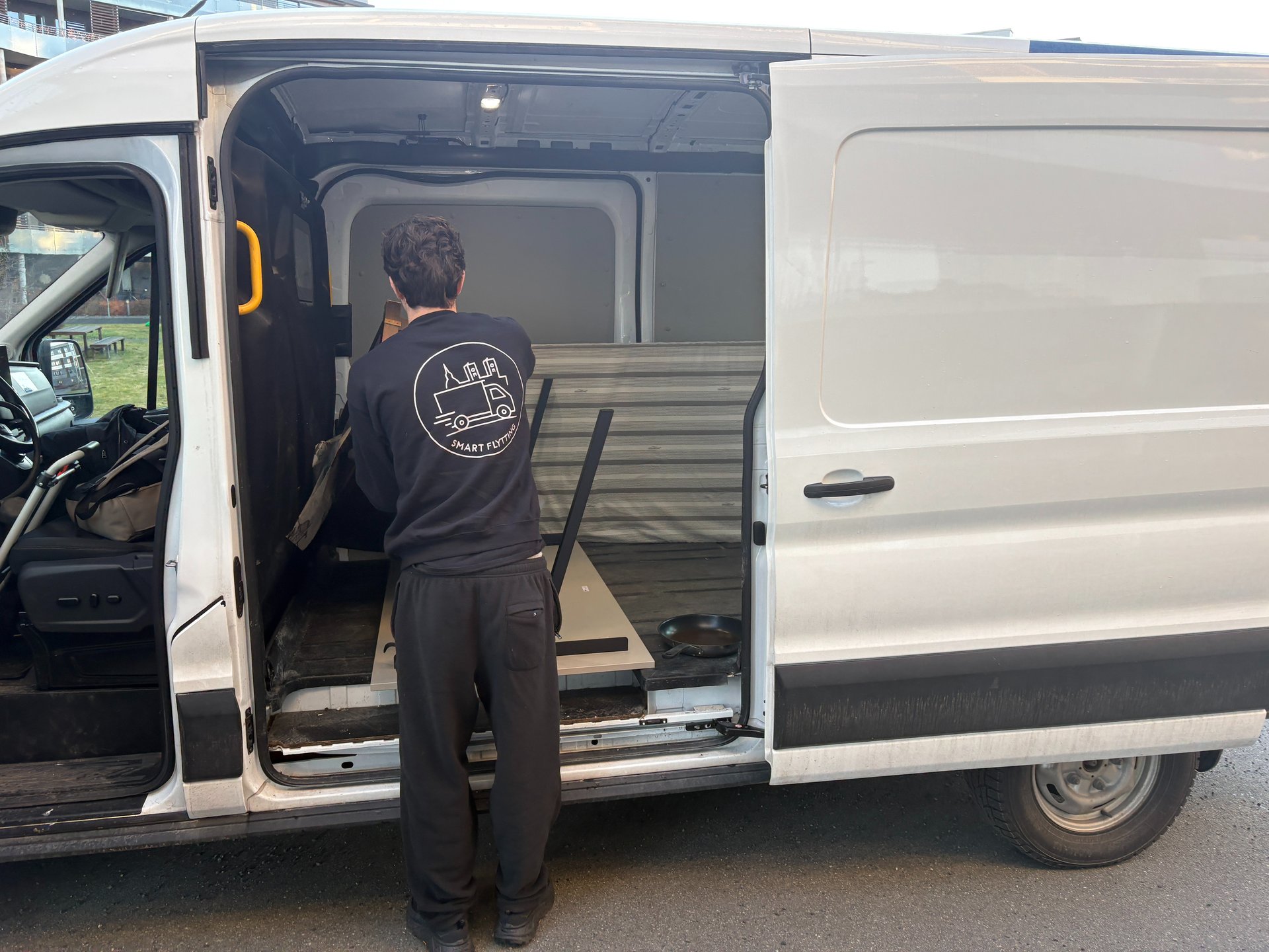 an abstract photo of a curved building with a blue sky in the background