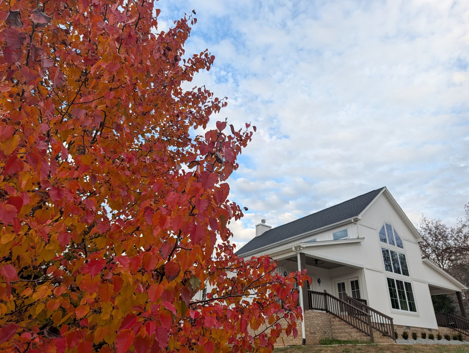 a group of people walking down a dirt road