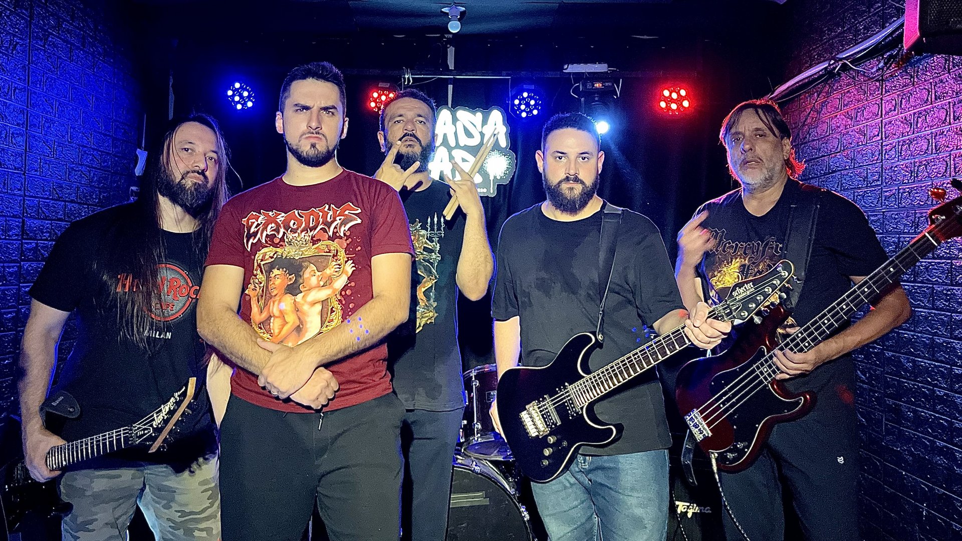 people raising their hands on concert