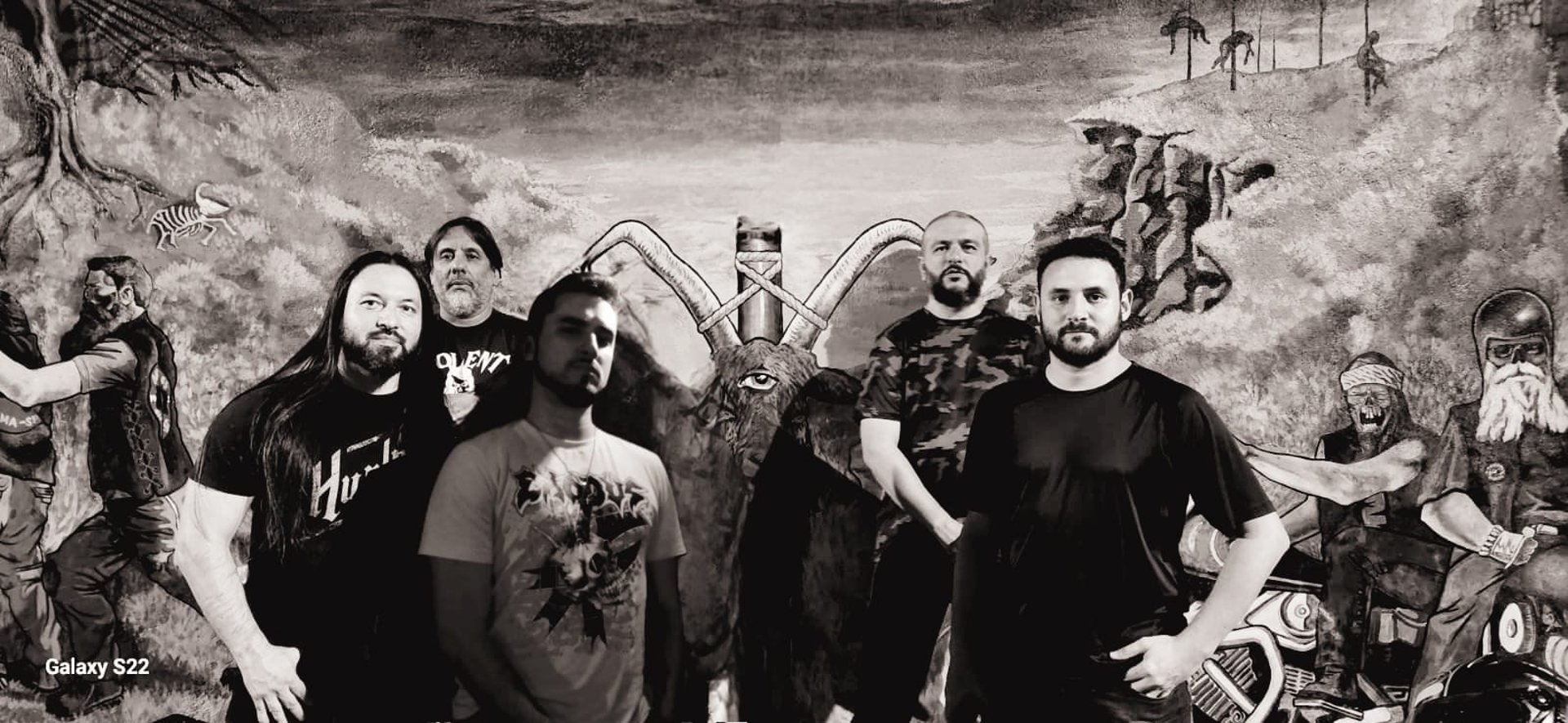 people raising their hands on concert