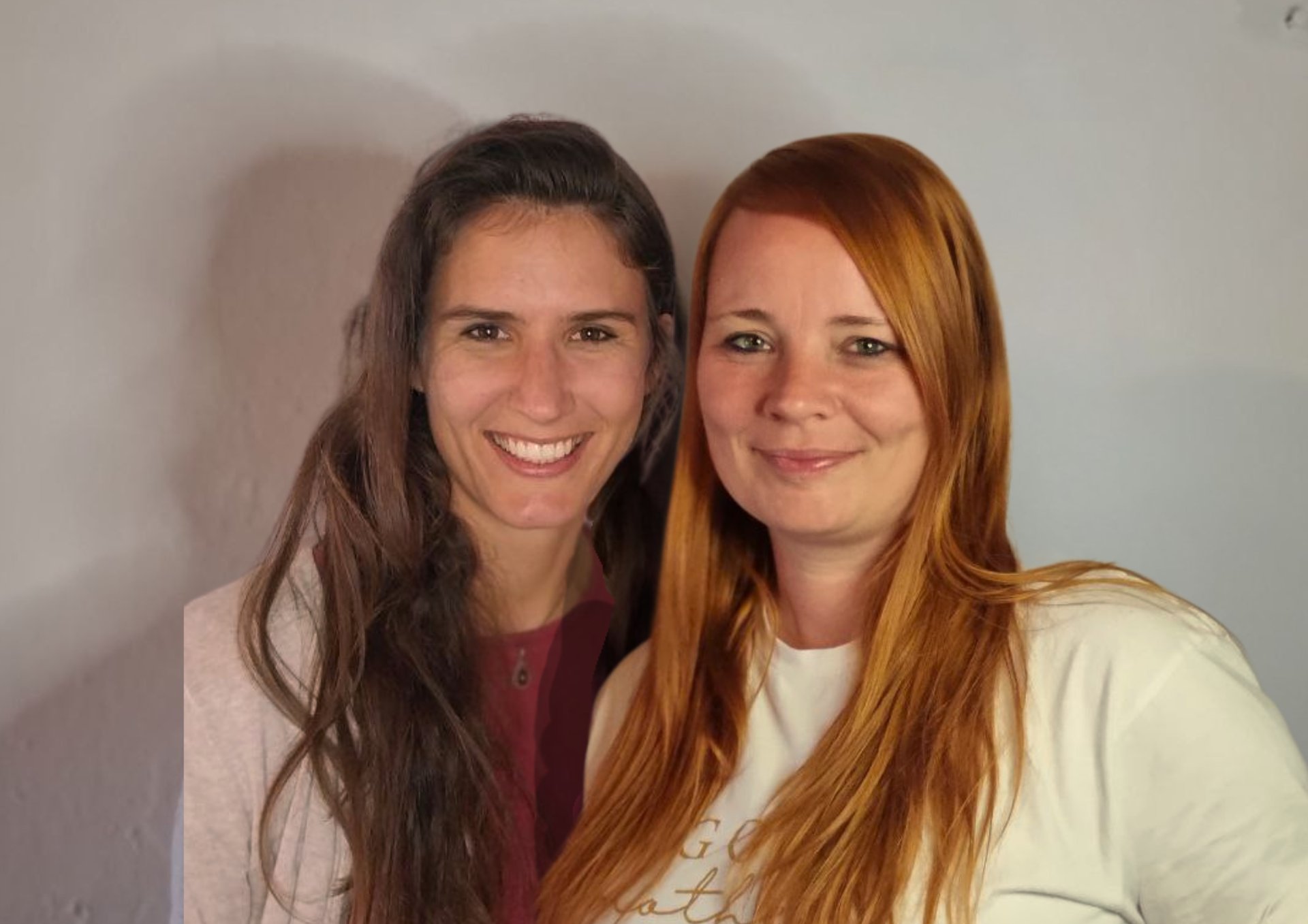 a couple of women standing next to each other in a bathroom