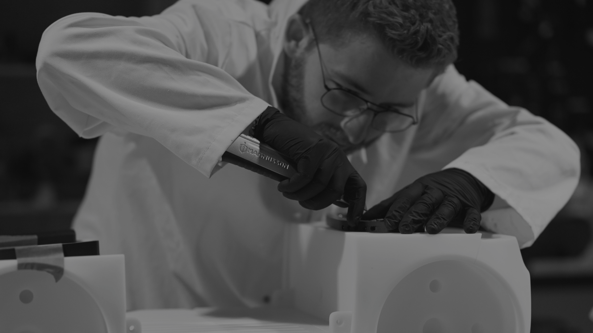 an abstract photo of a curved building with a blue sky in the background