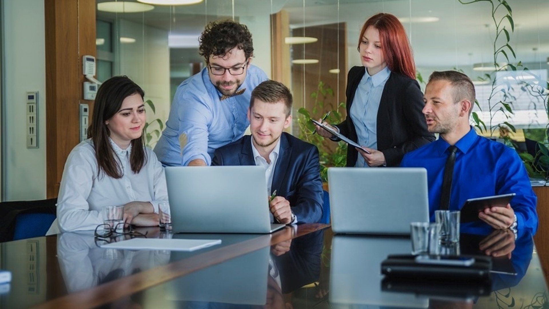 an abstract photo of a curved building with a blue sky in the background