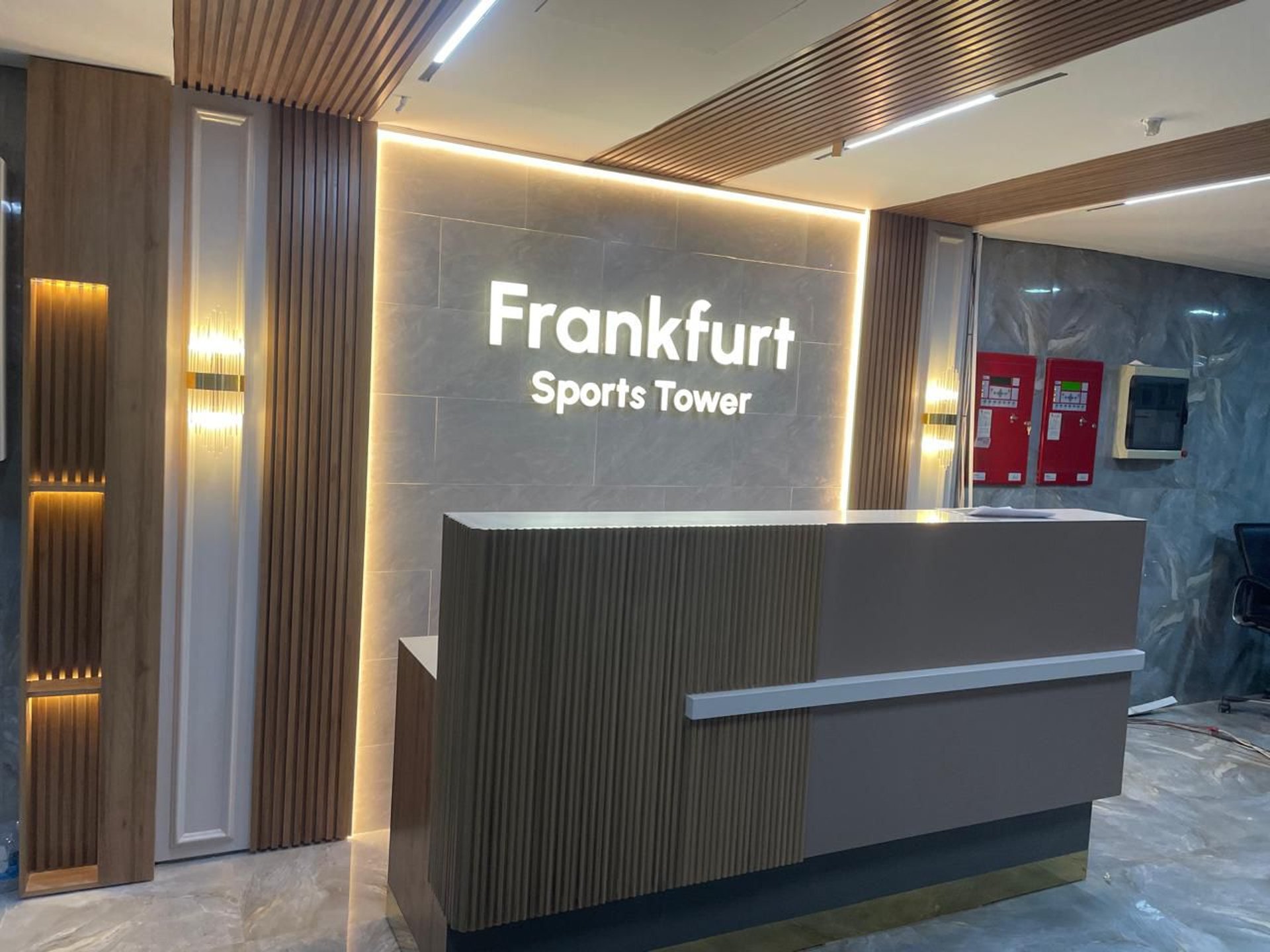 an abstract photo of a curved building with a blue sky in the background