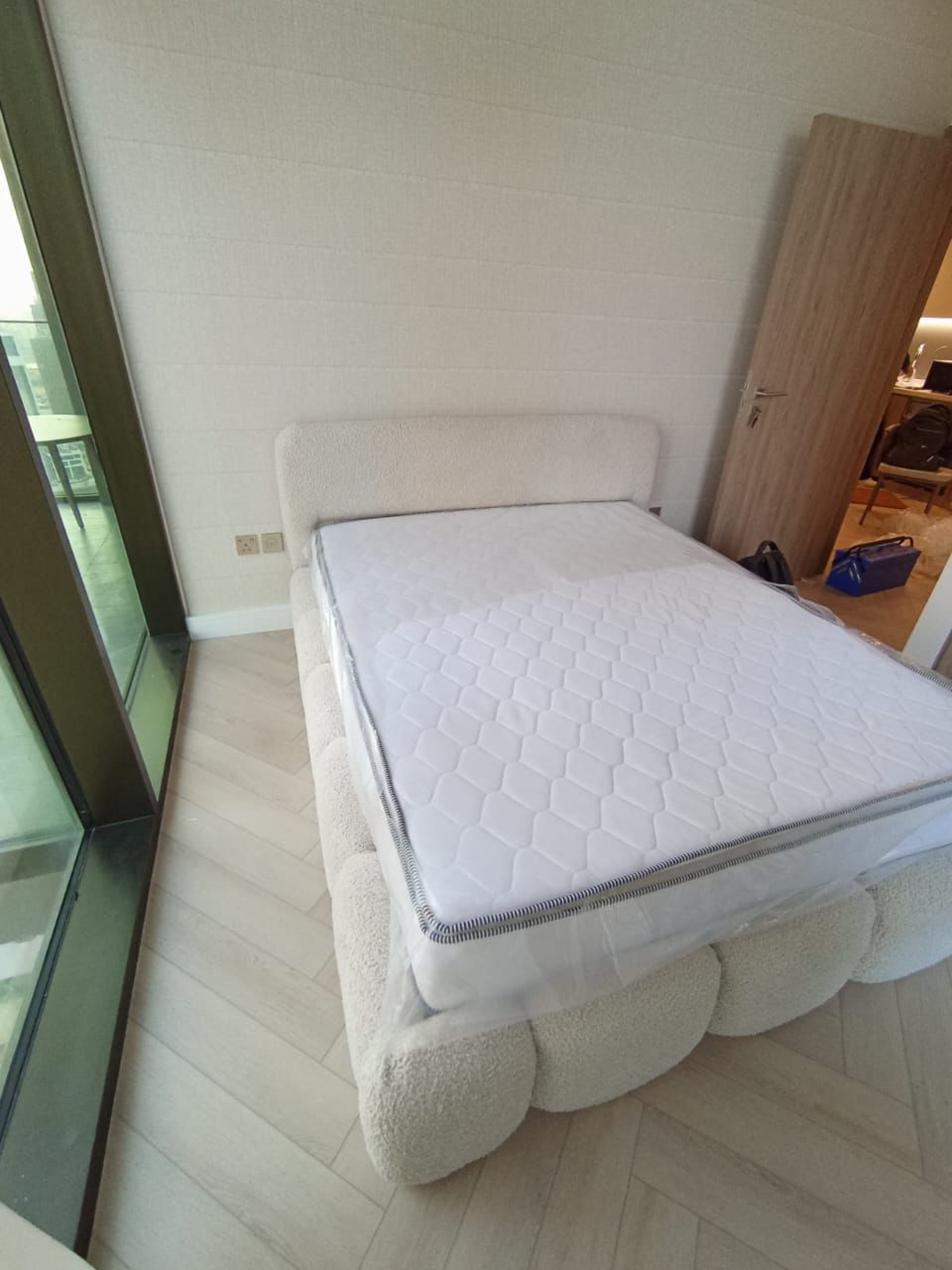 an abstract photo of a curved building with a blue sky in the background