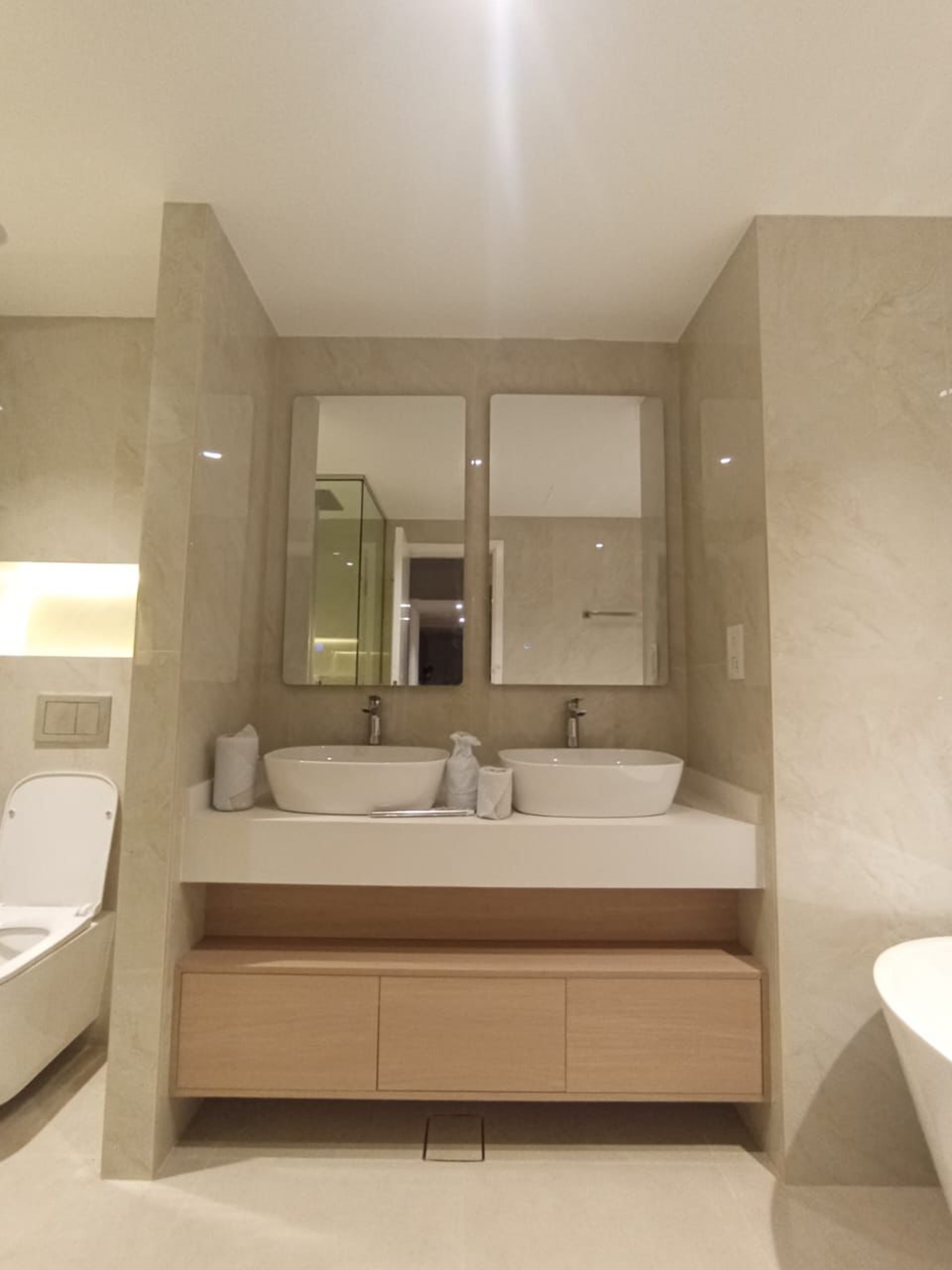 an abstract photo of a curved building with a blue sky in the background