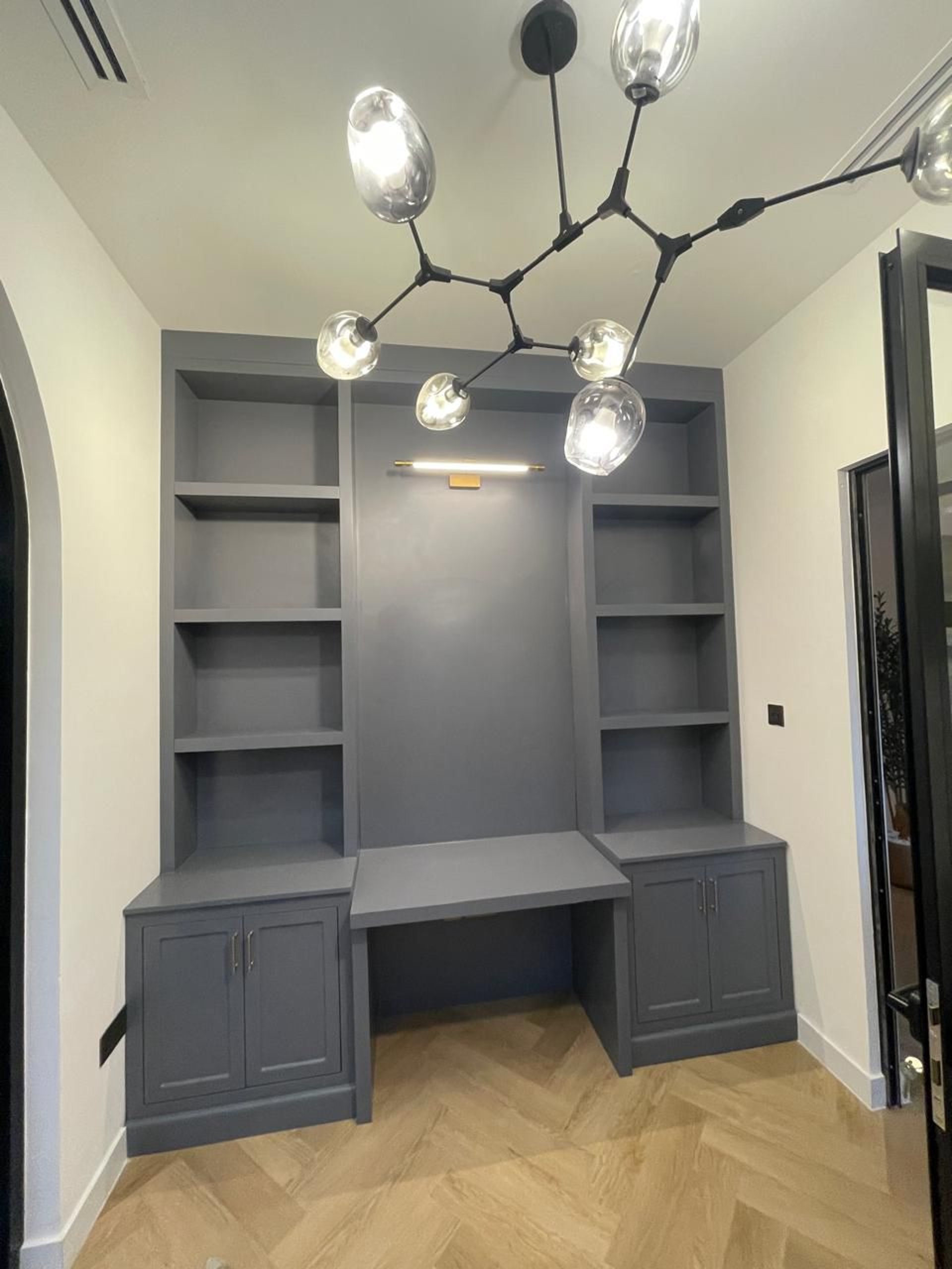 an abstract photo of a curved building with a blue sky in the background