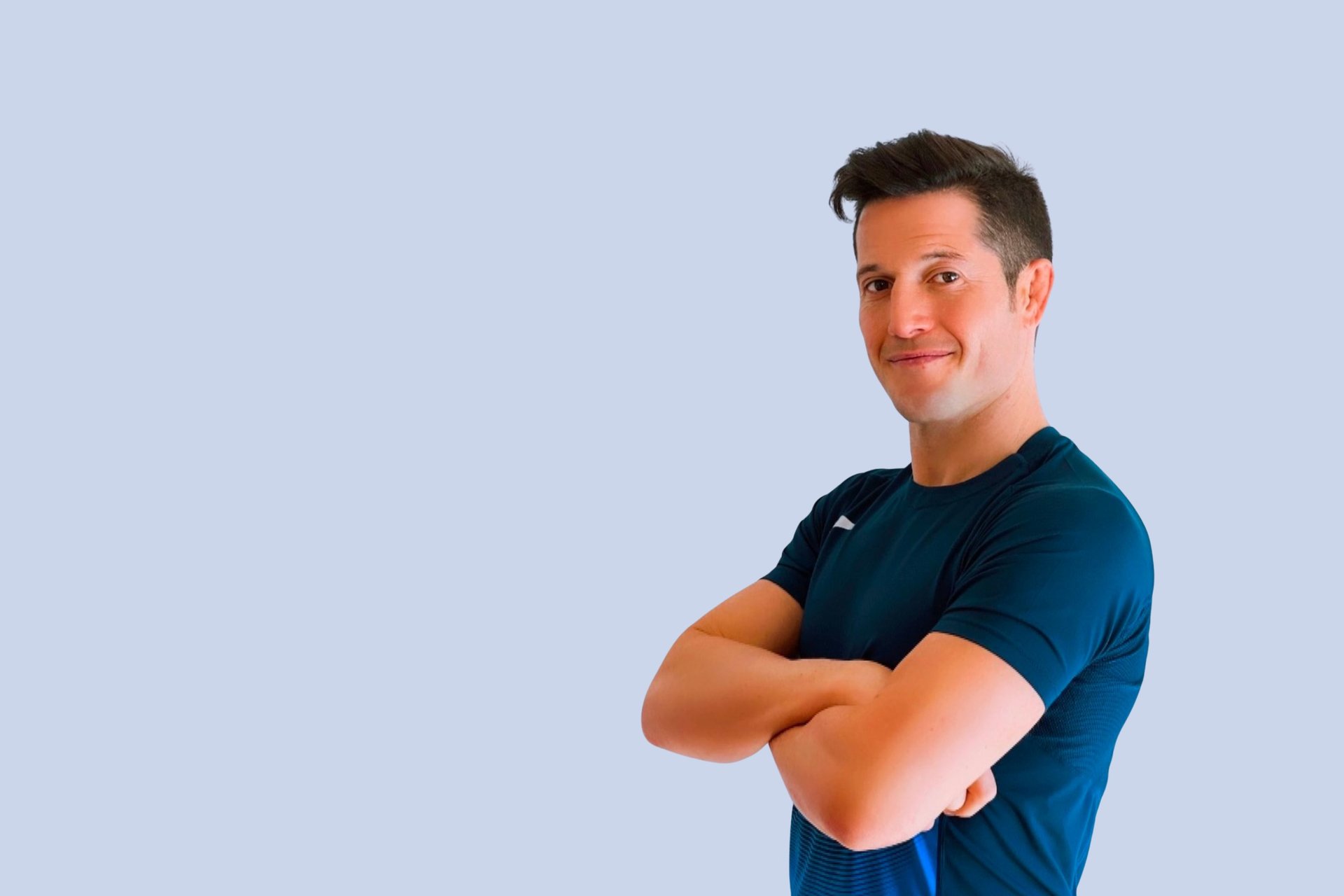 topless man using rowing machine