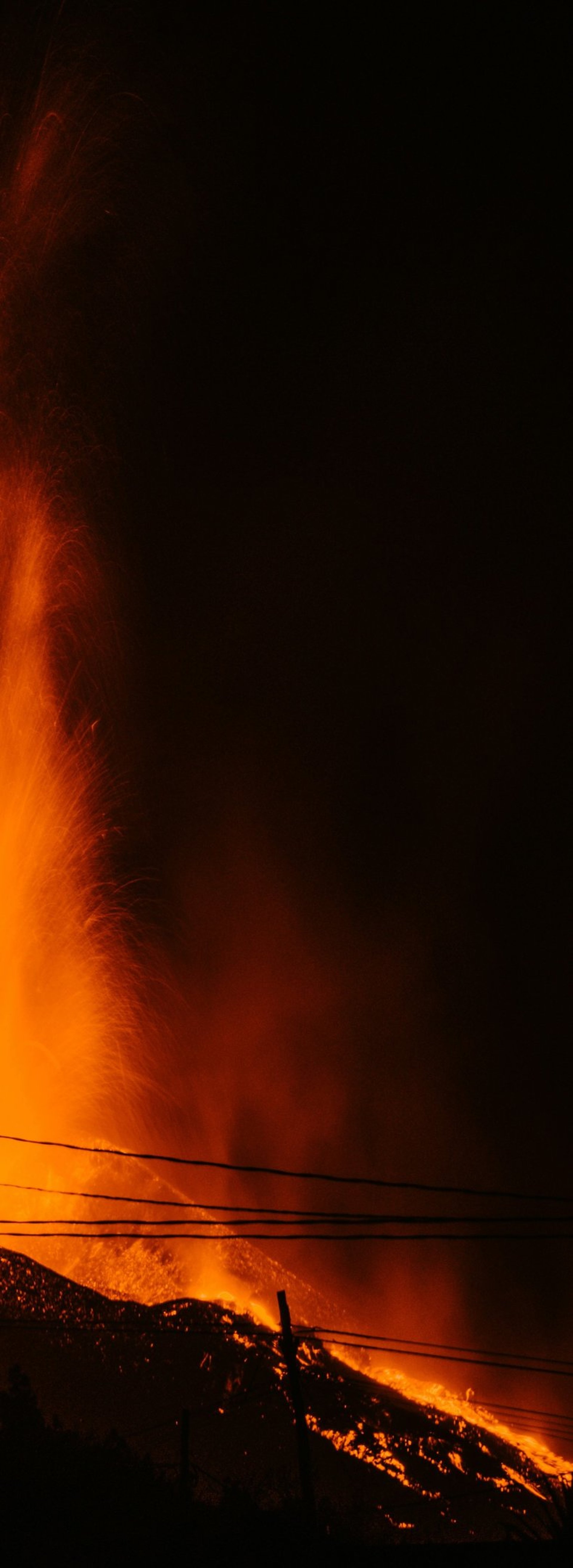 a large fire is lit up in the dark