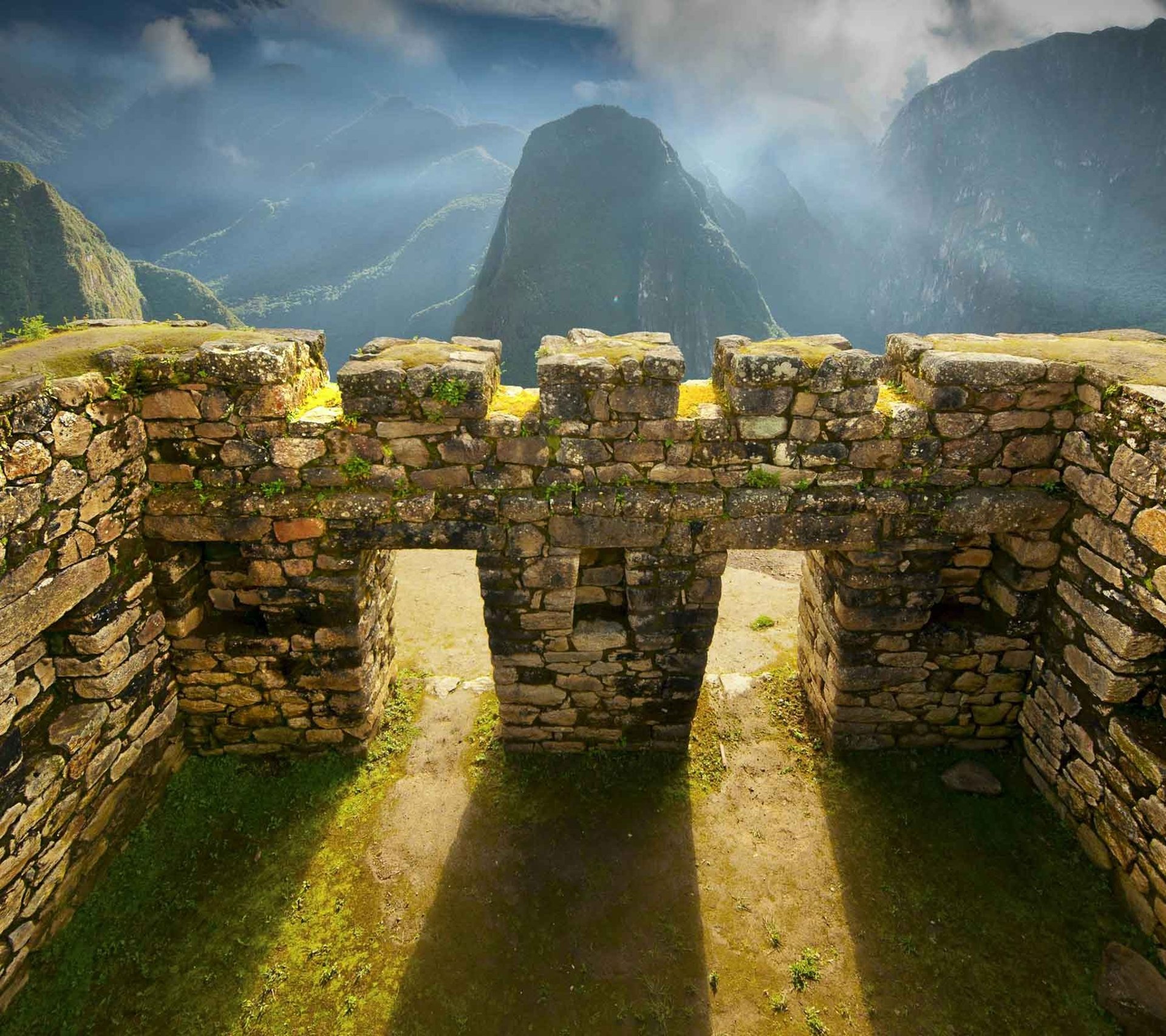 an abstract photo of a curved building with a blue sky in the background