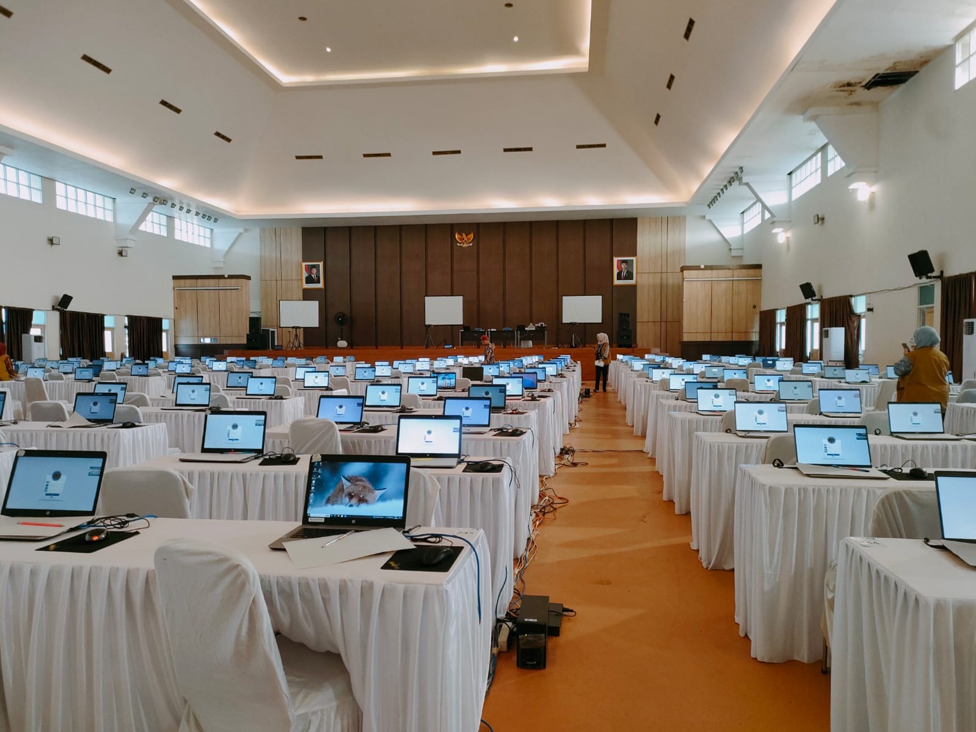 an abstract photo of a curved building with a blue sky in the background