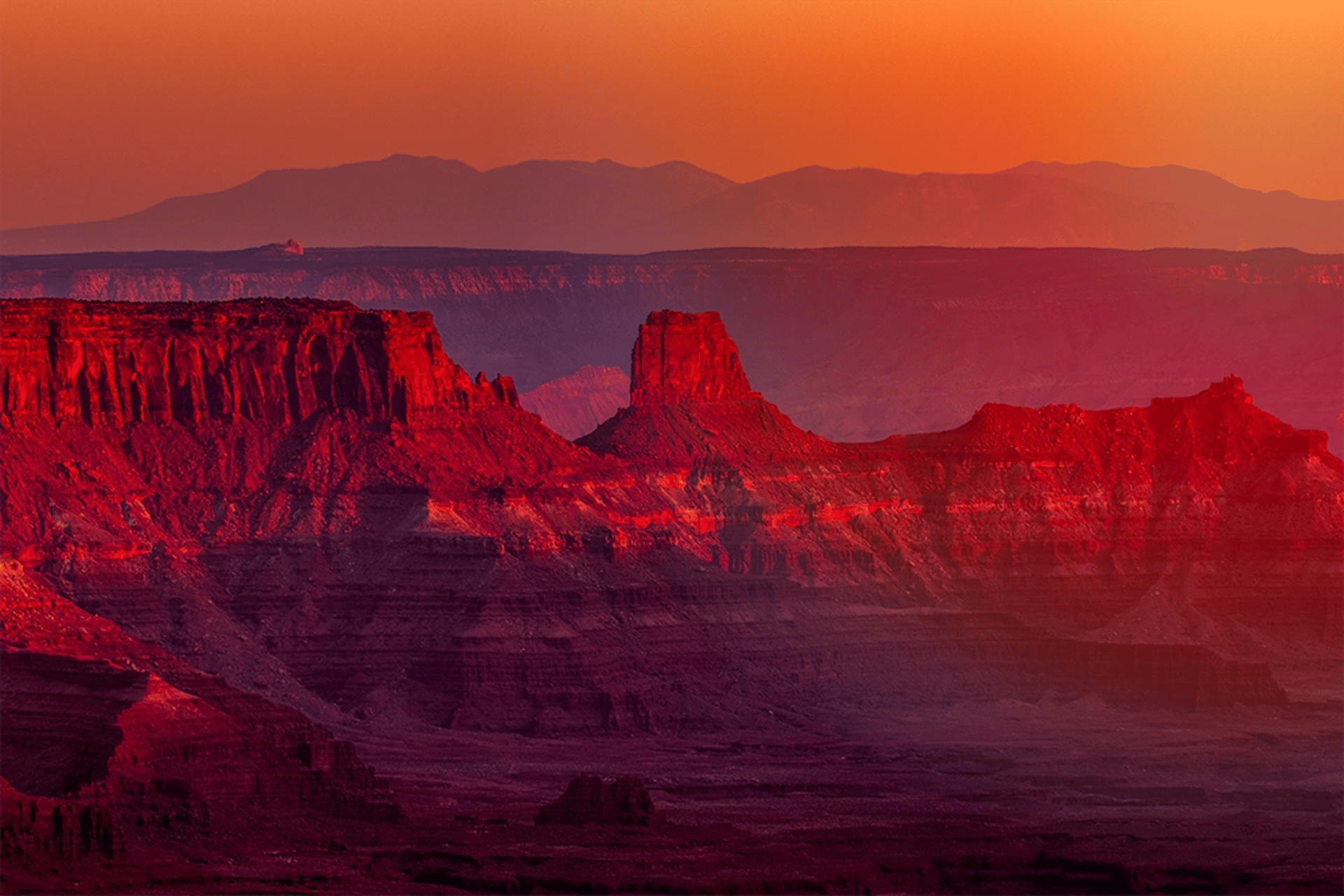 a lightning strikes in the sky over a canyon