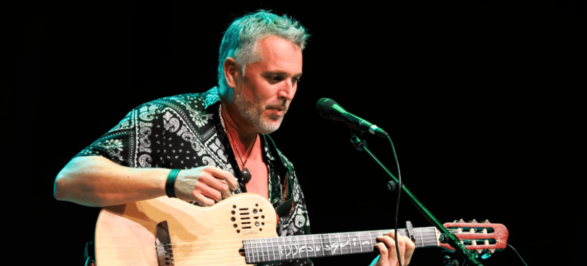 teal and brown electric guitar