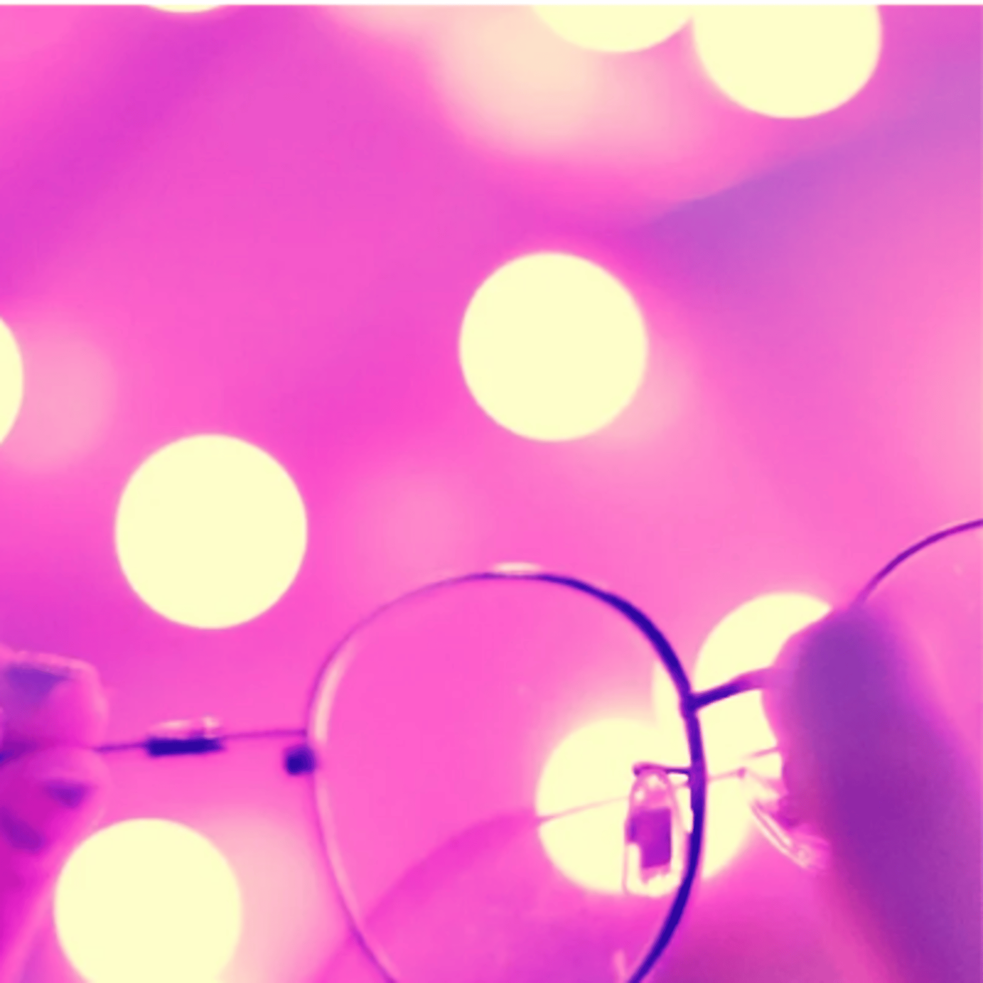 an abstract photo of a curved building with a blue sky in the background