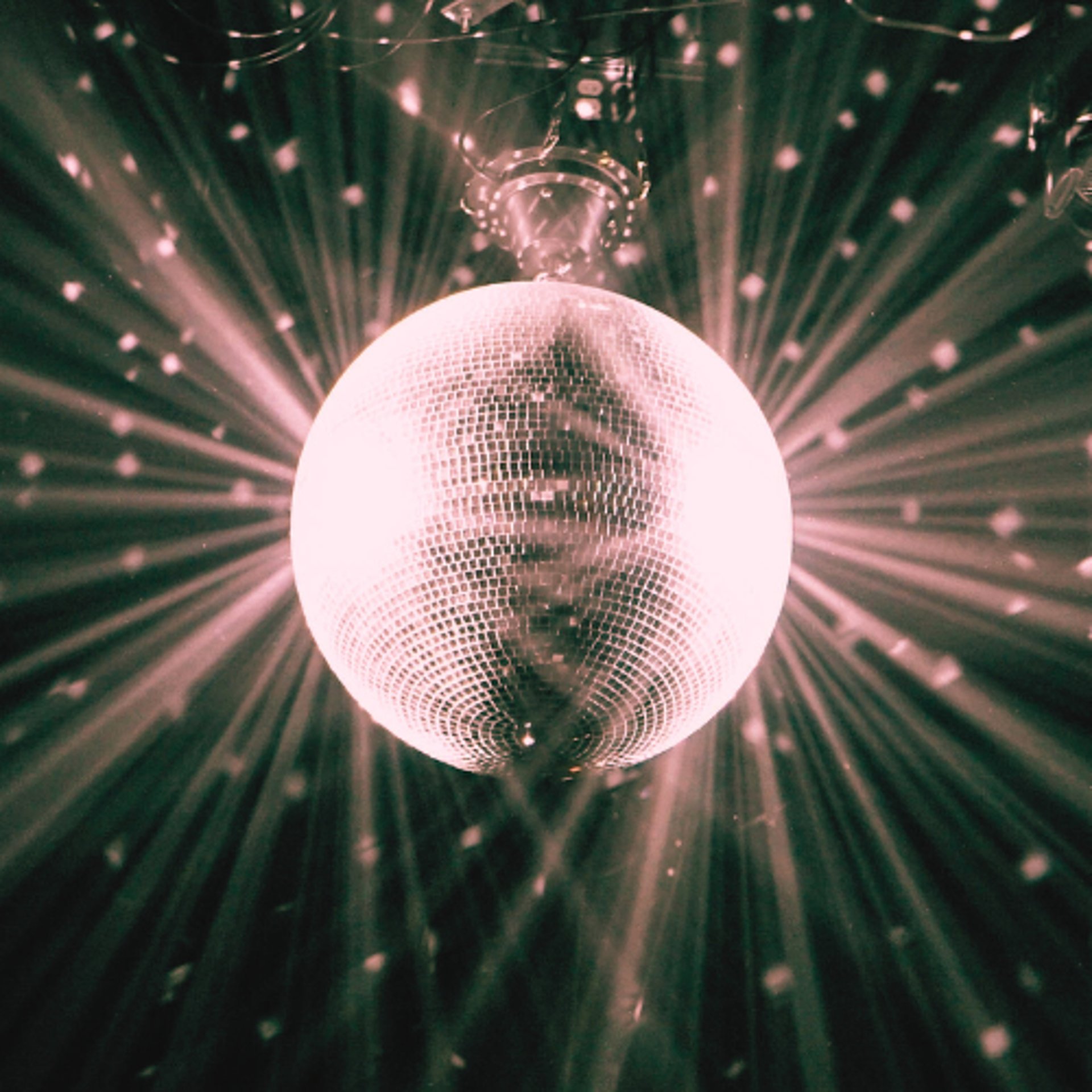 an abstract photo of a curved building with a blue sky in the background