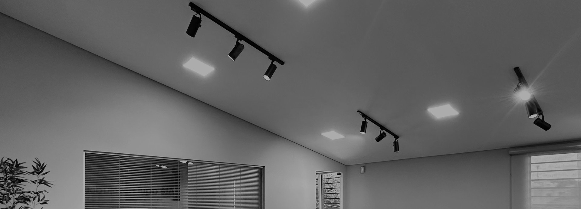 four black pendant lamps in room