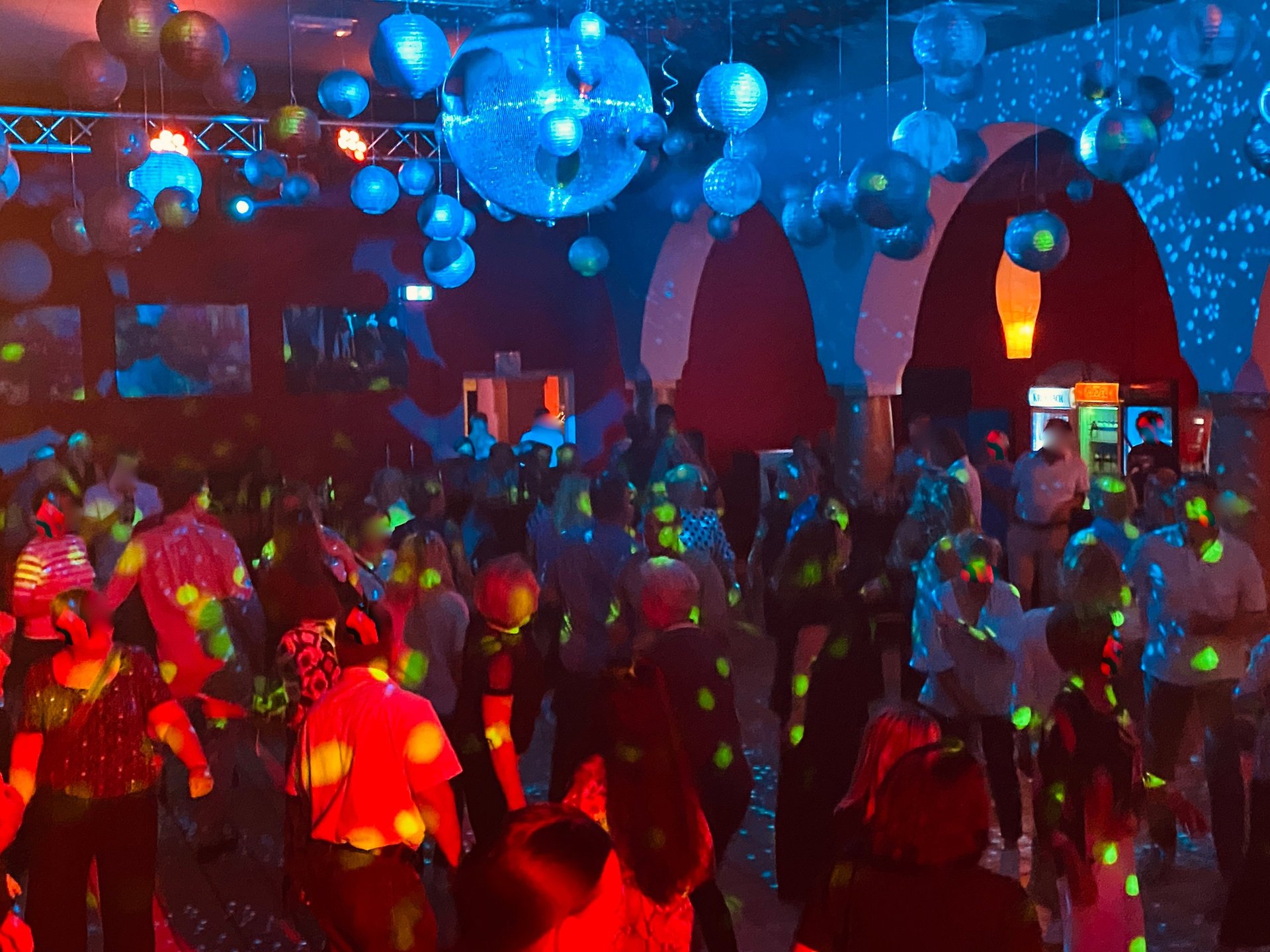 Couples dancing ballroom in a dimly lit hall