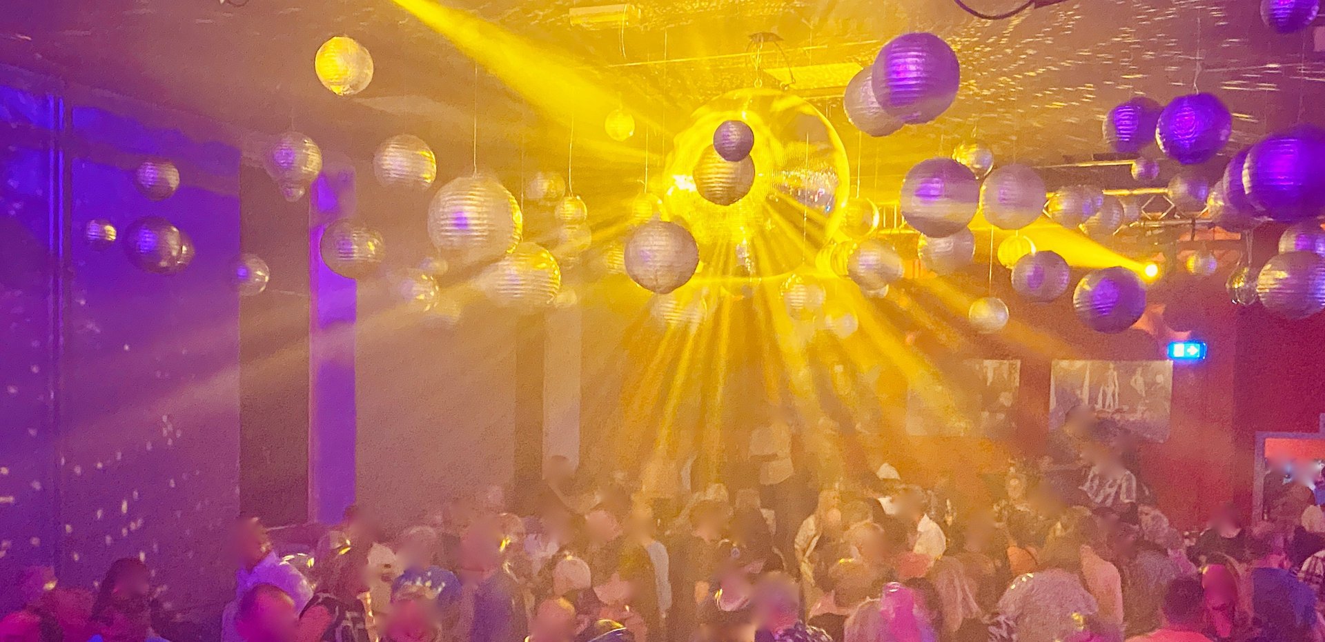 a group of people in a room with lights