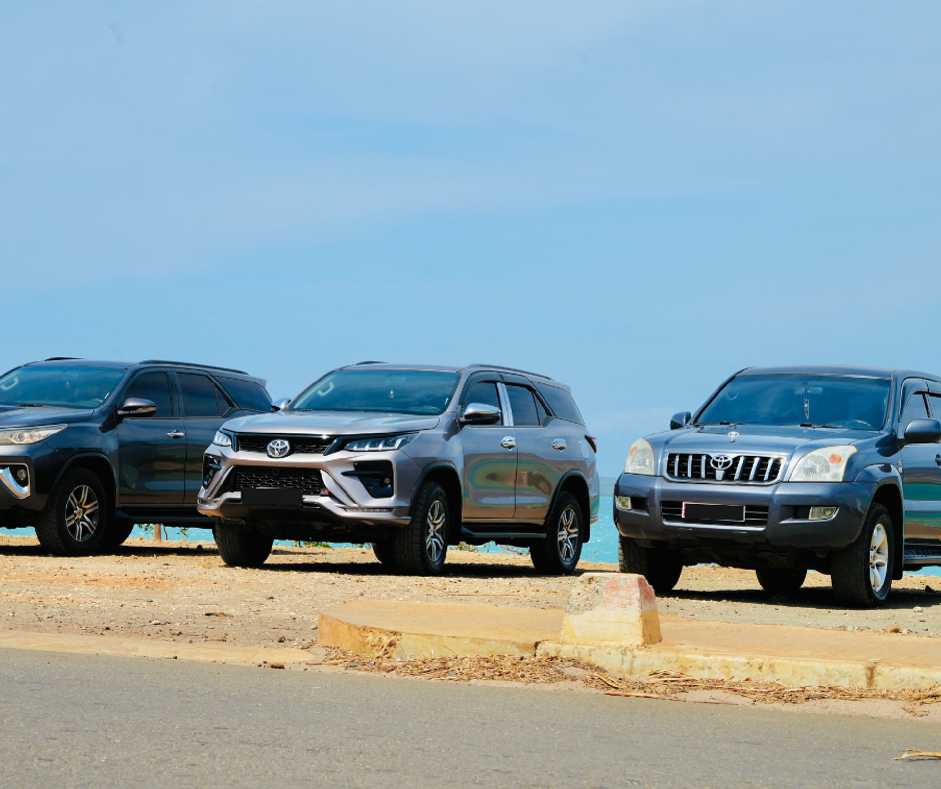 an abstract photo of a curved building with a blue sky in the background