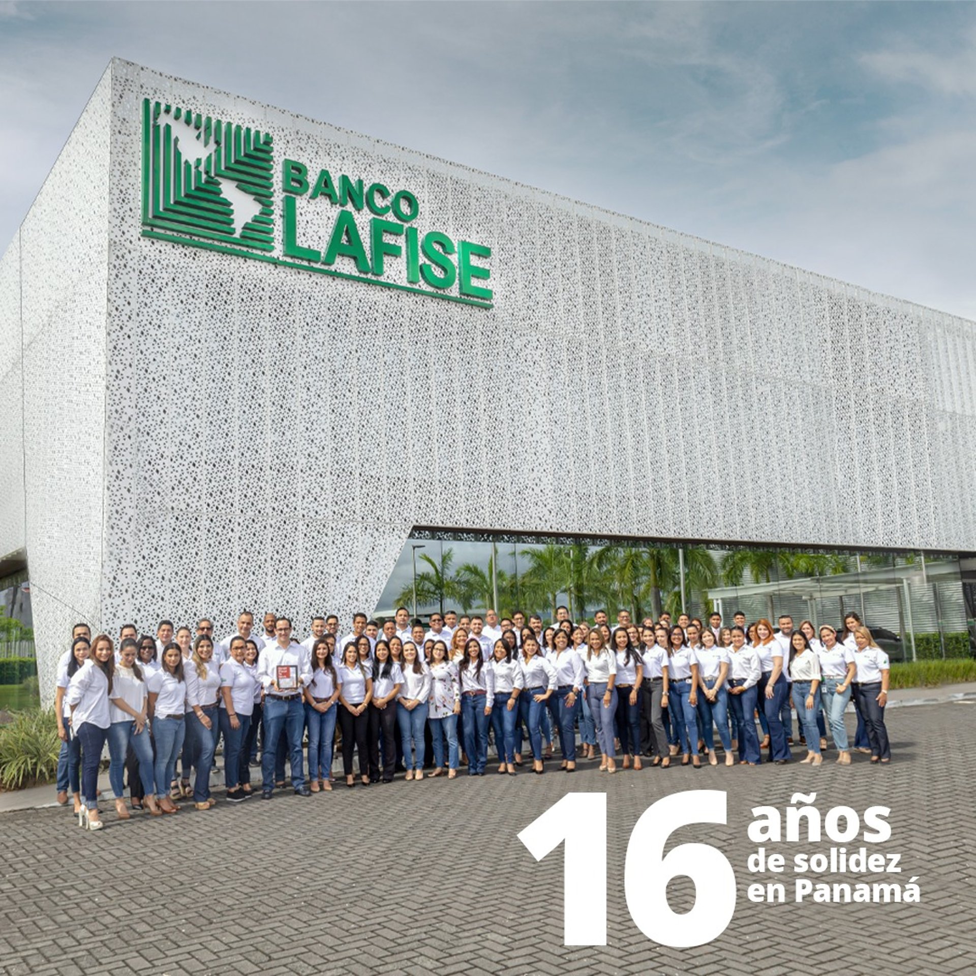 an abstract photo of a curved building with a blue sky in the background