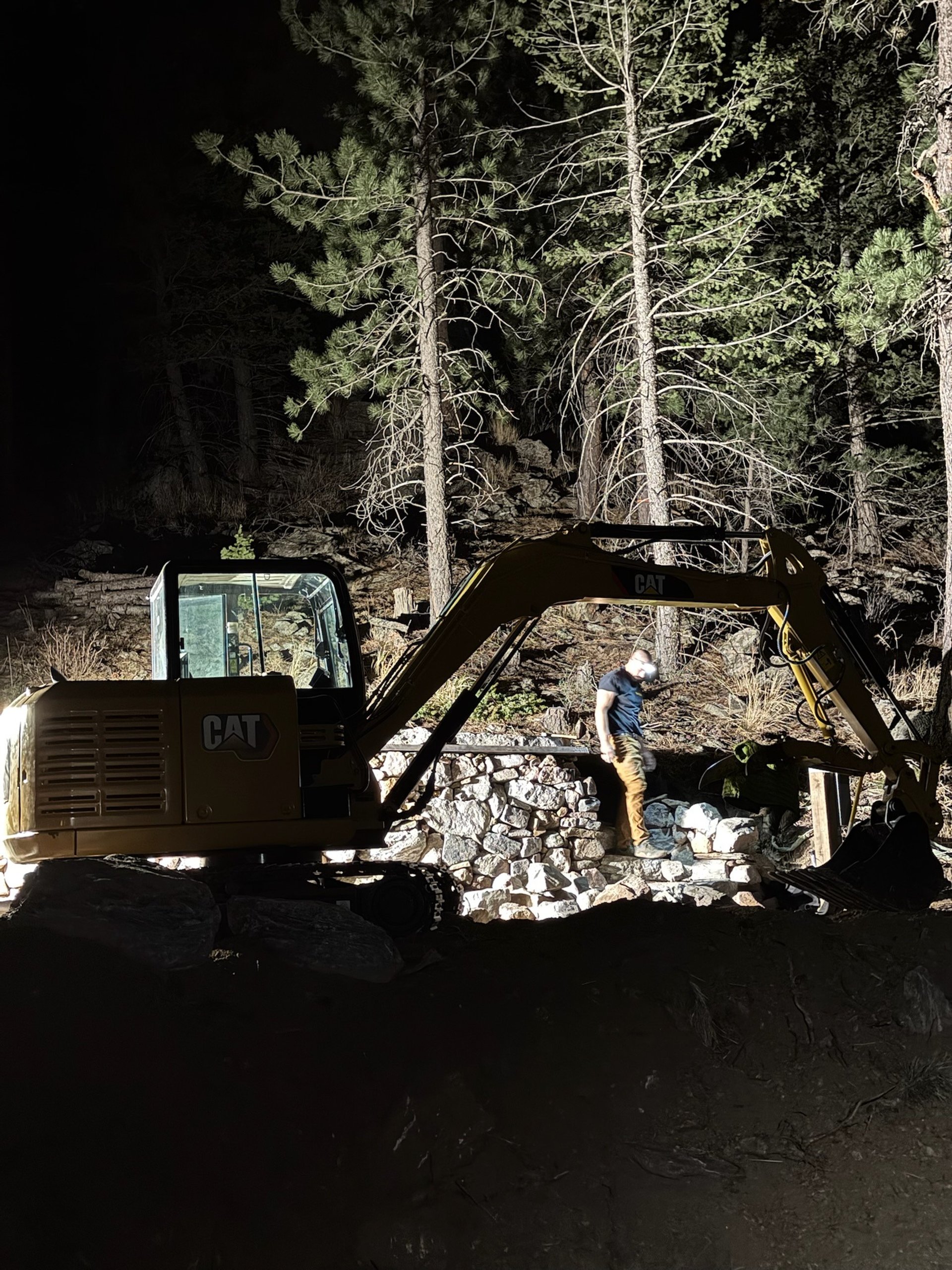brown rocky mountain near lake during daytime