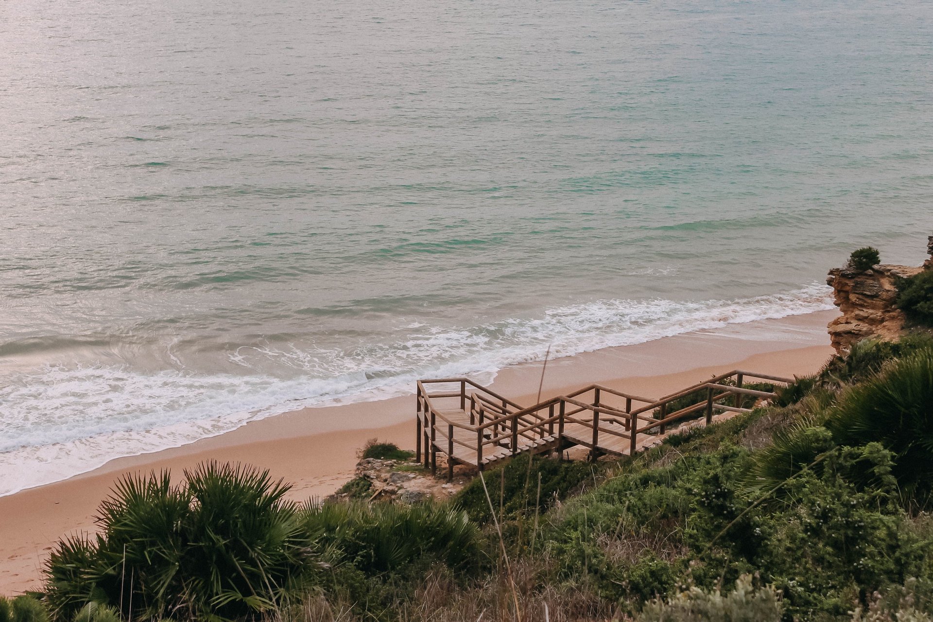 an abstract photo of a curved building with a blue sky in the background