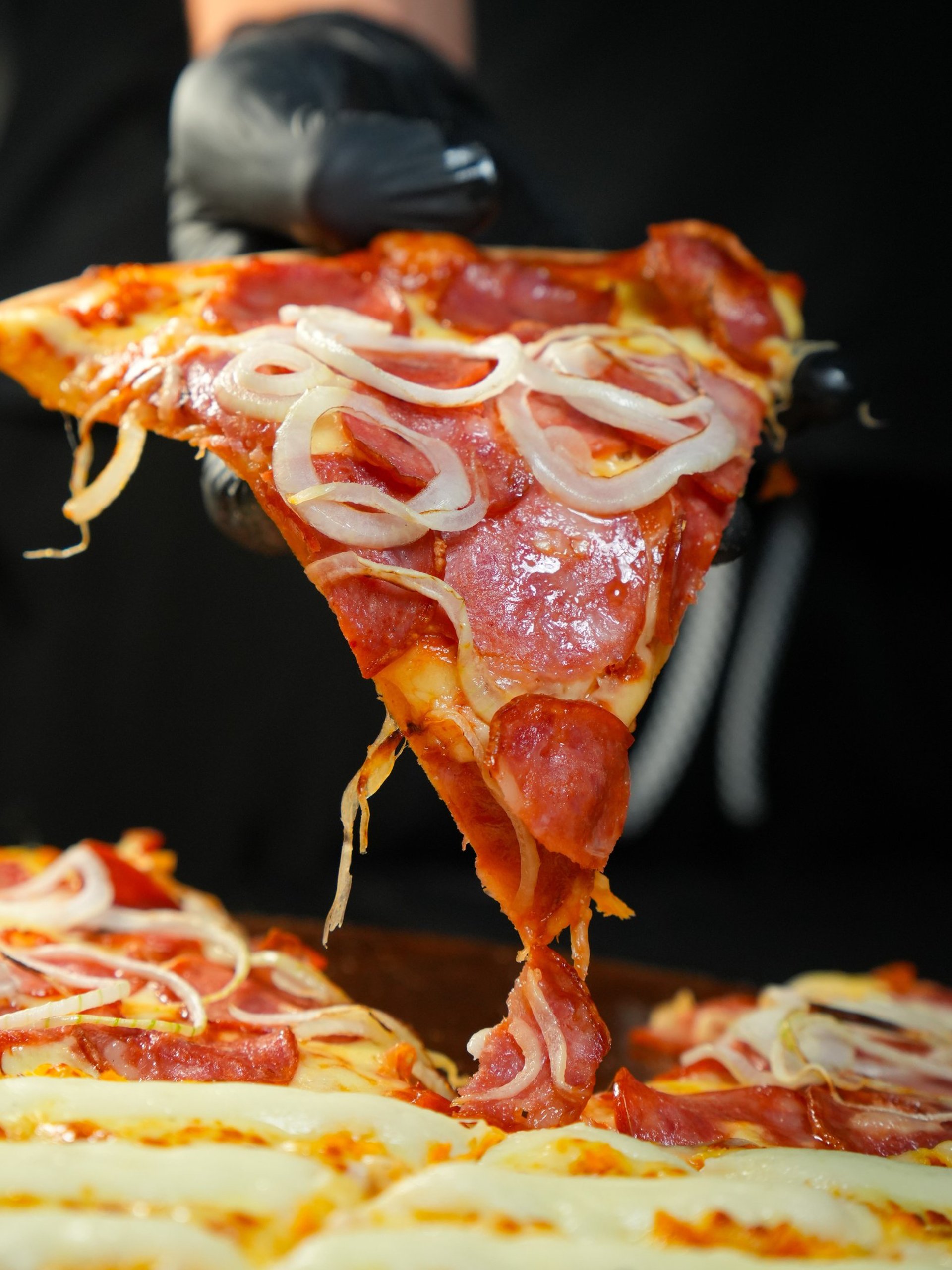 an abstract photo of a curved building with a blue sky in the background