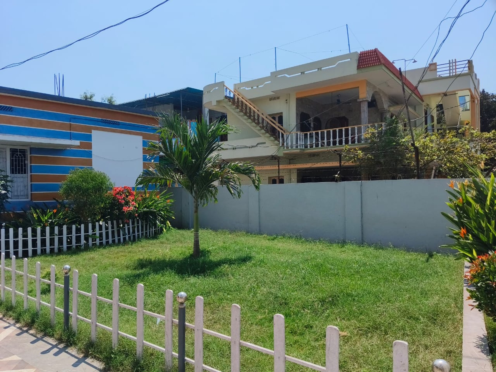 woman wearing yellow long-sleeved dress under white clouds and blue sky during daytime