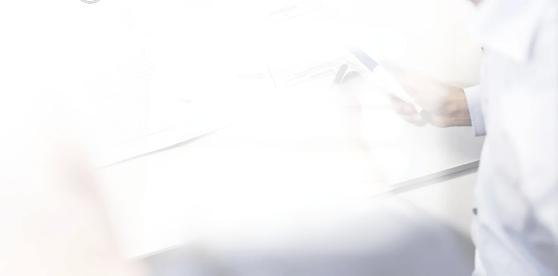 white desk lamp beside green plant