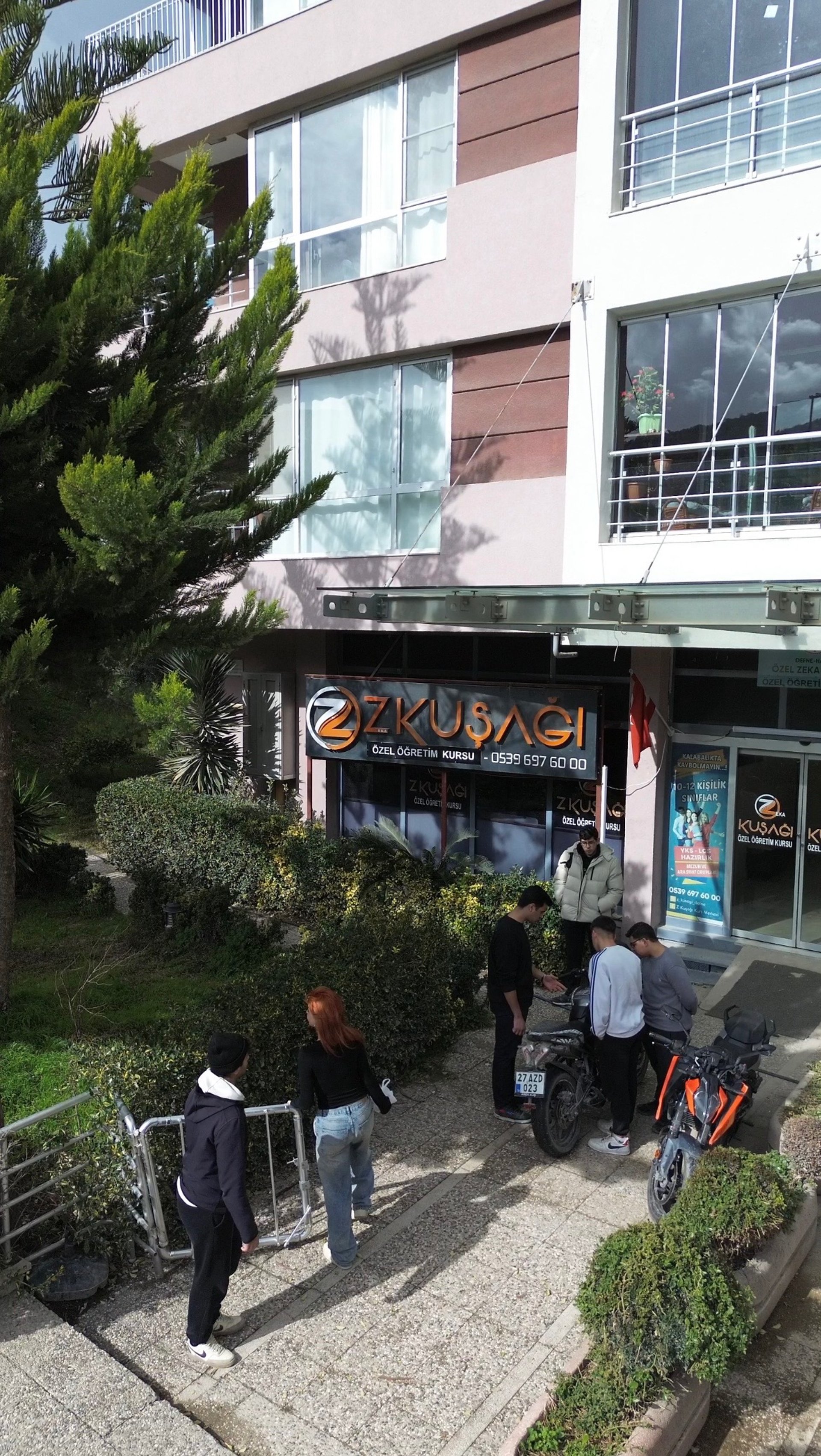 man in blue crew neck shirt wearing black framed eyeglasses holding green ceramic mug