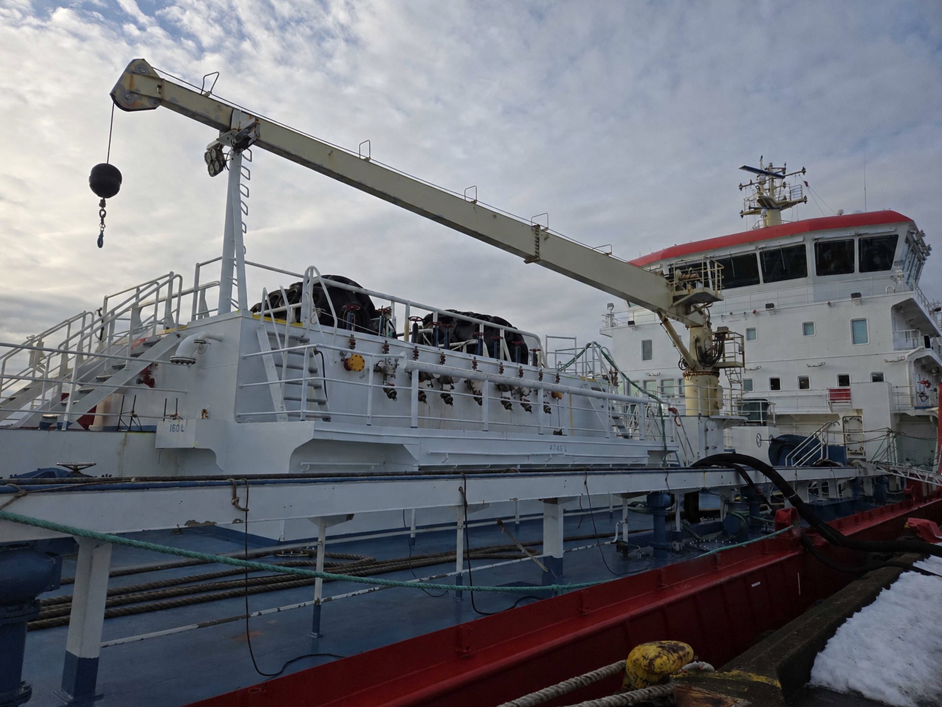 Crane loading cargo onto a ship