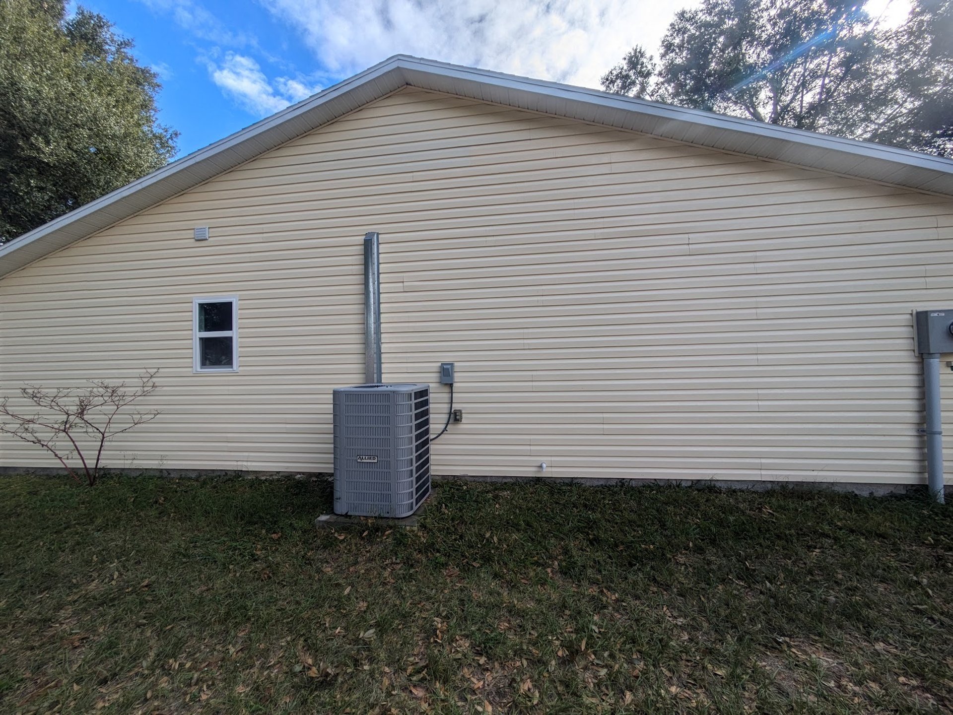 woman wearing yellow long-sleeved dress under white clouds and blue sky during daytime