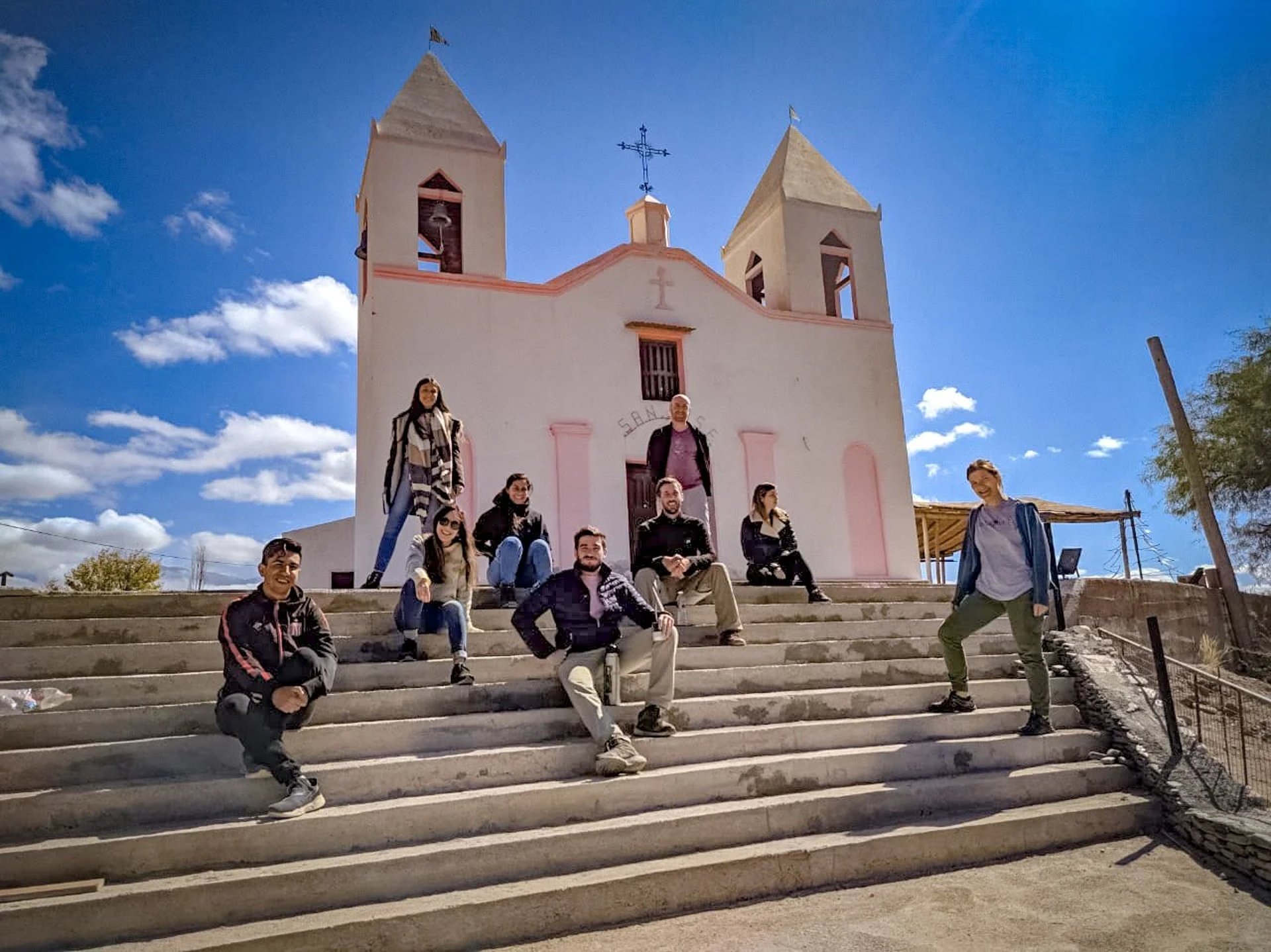 an abstract photo of a curved building with a blue sky in the background