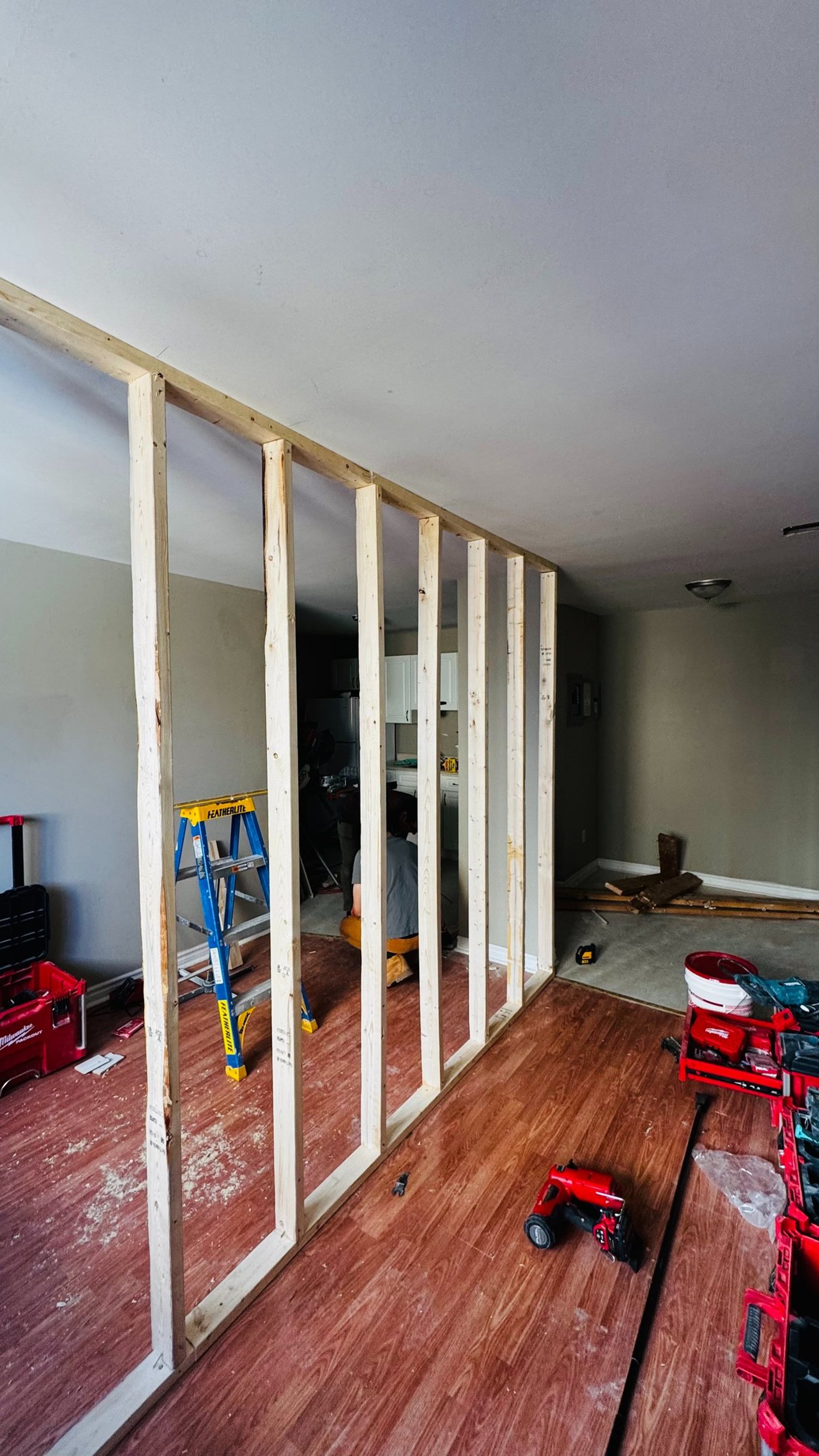 woman wearing yellow long-sleeved dress under white clouds and blue sky during daytime