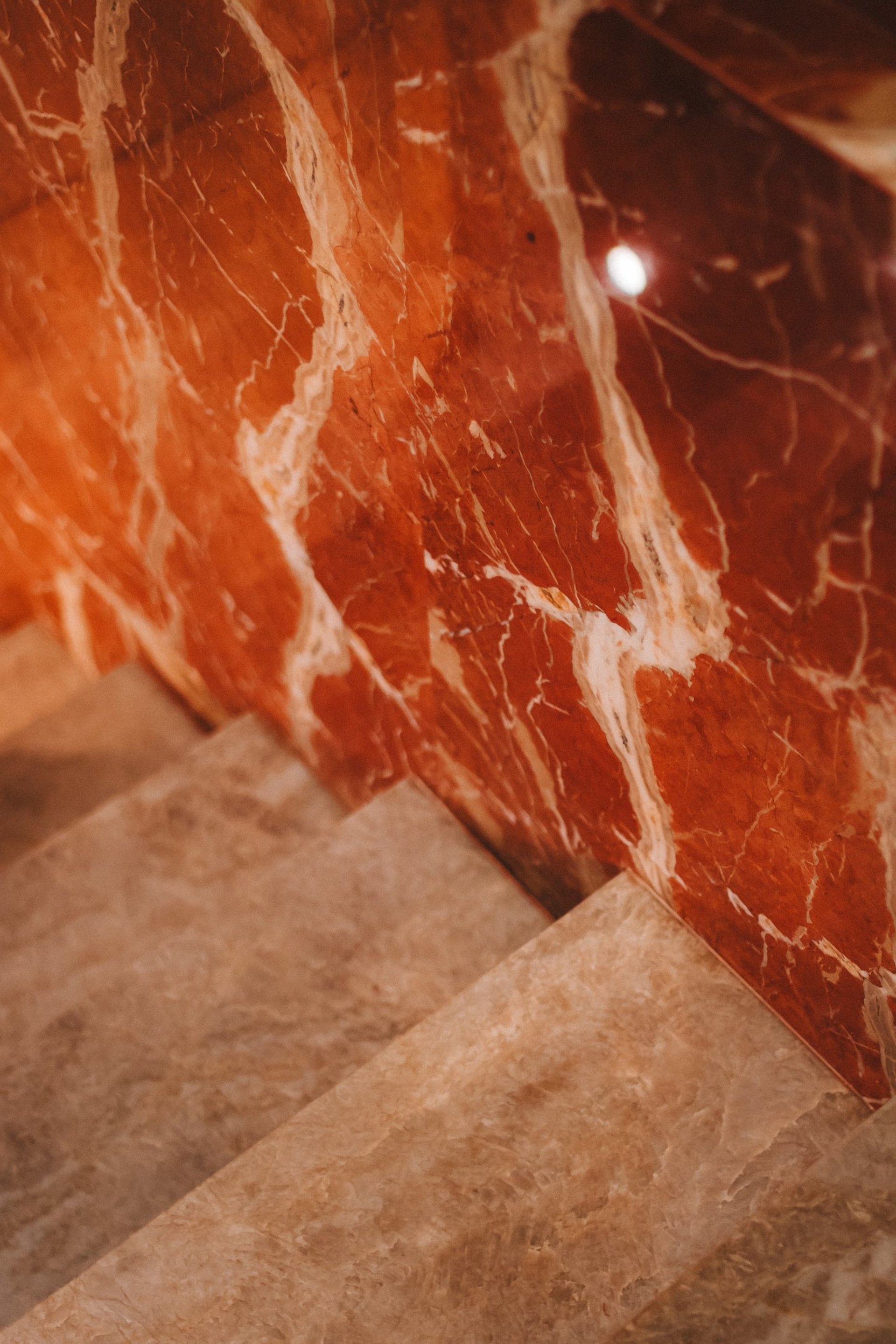an abstract photo of a curved building with a blue sky in the background