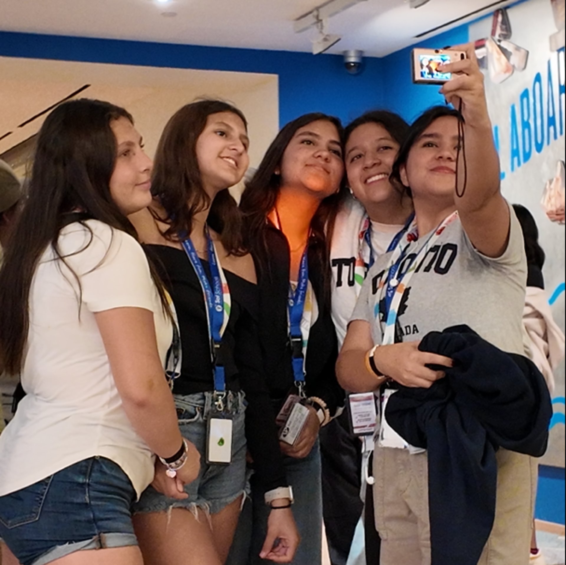 woman wearing yellow long-sleeved dress under white clouds and blue sky during daytime