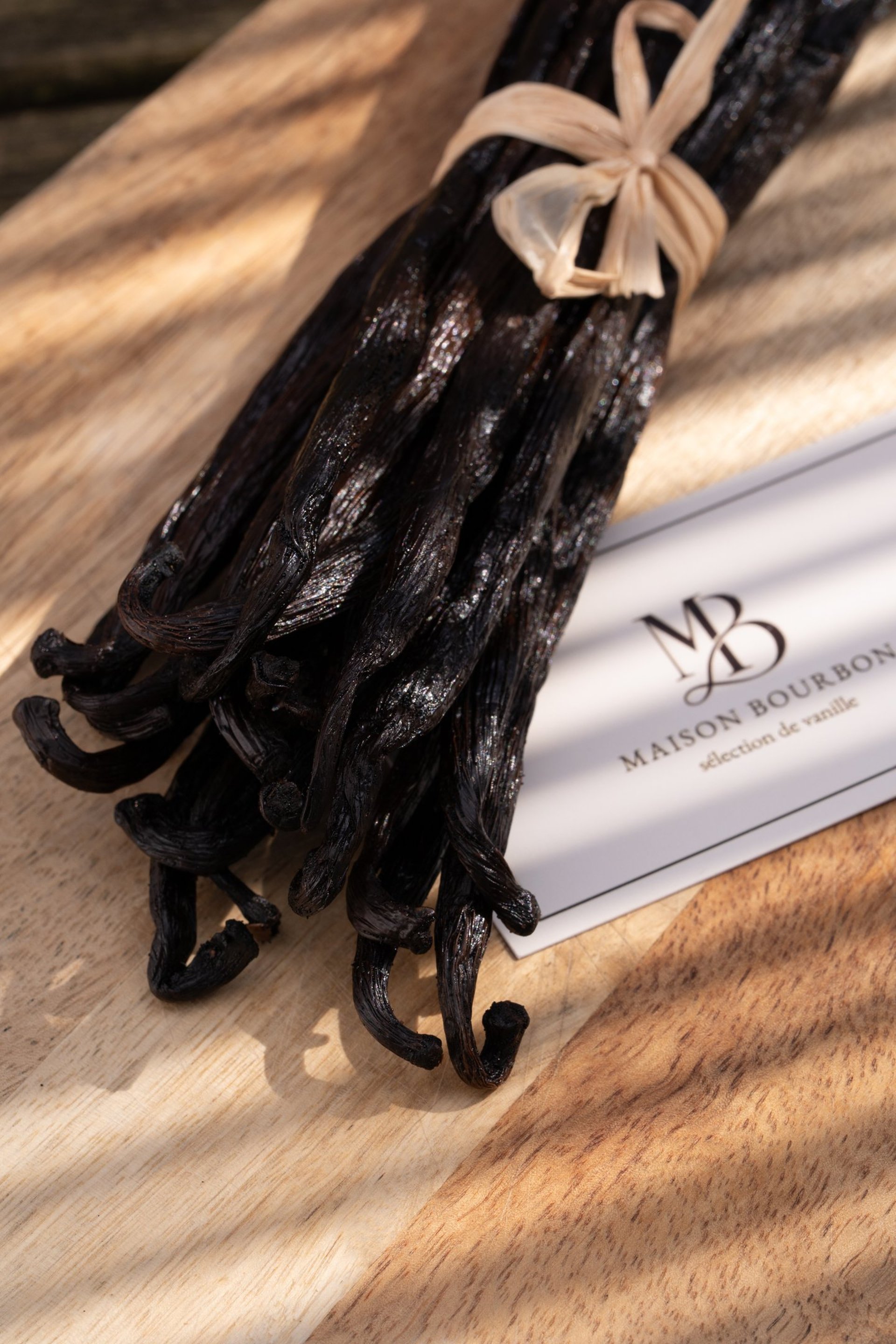 a bundle of sticks sitting on top of a wooden table